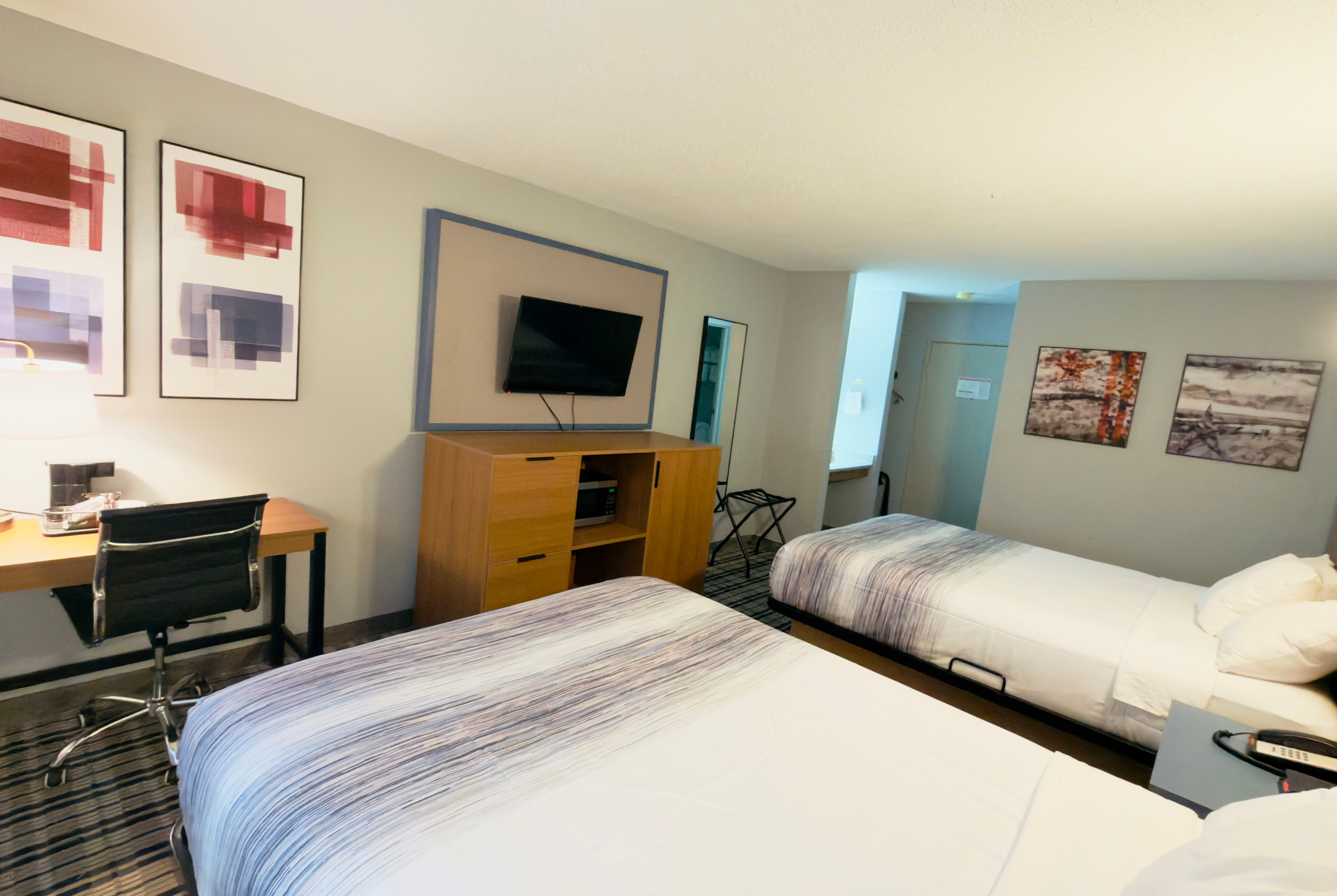 Guest room at the AmericInn by Wyndham Lake Mills in Lake Mills, Wisconsin