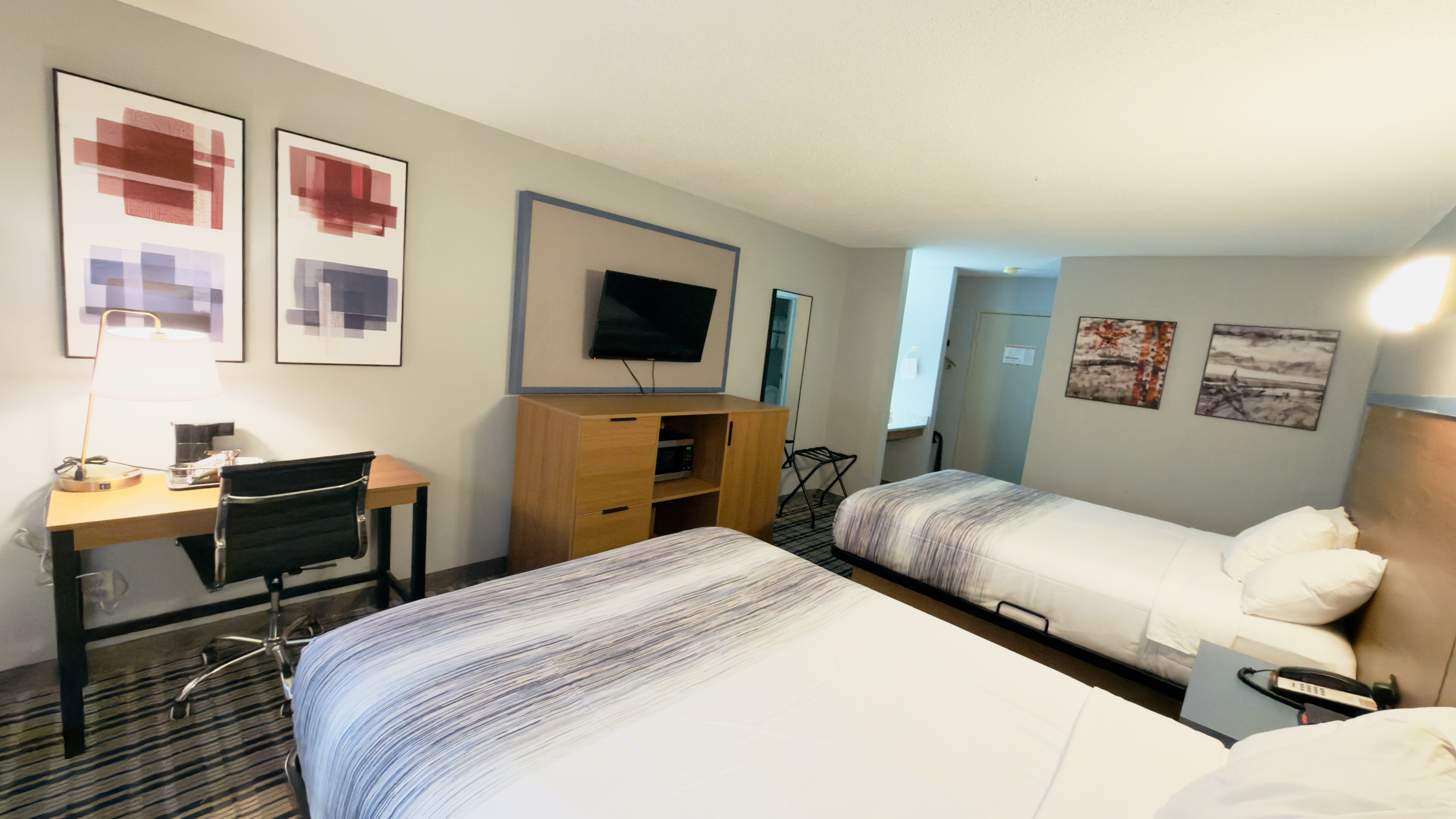 Guest room at the AmericInn by Wyndham Lake Mills in Lake Mills, Wisconsin