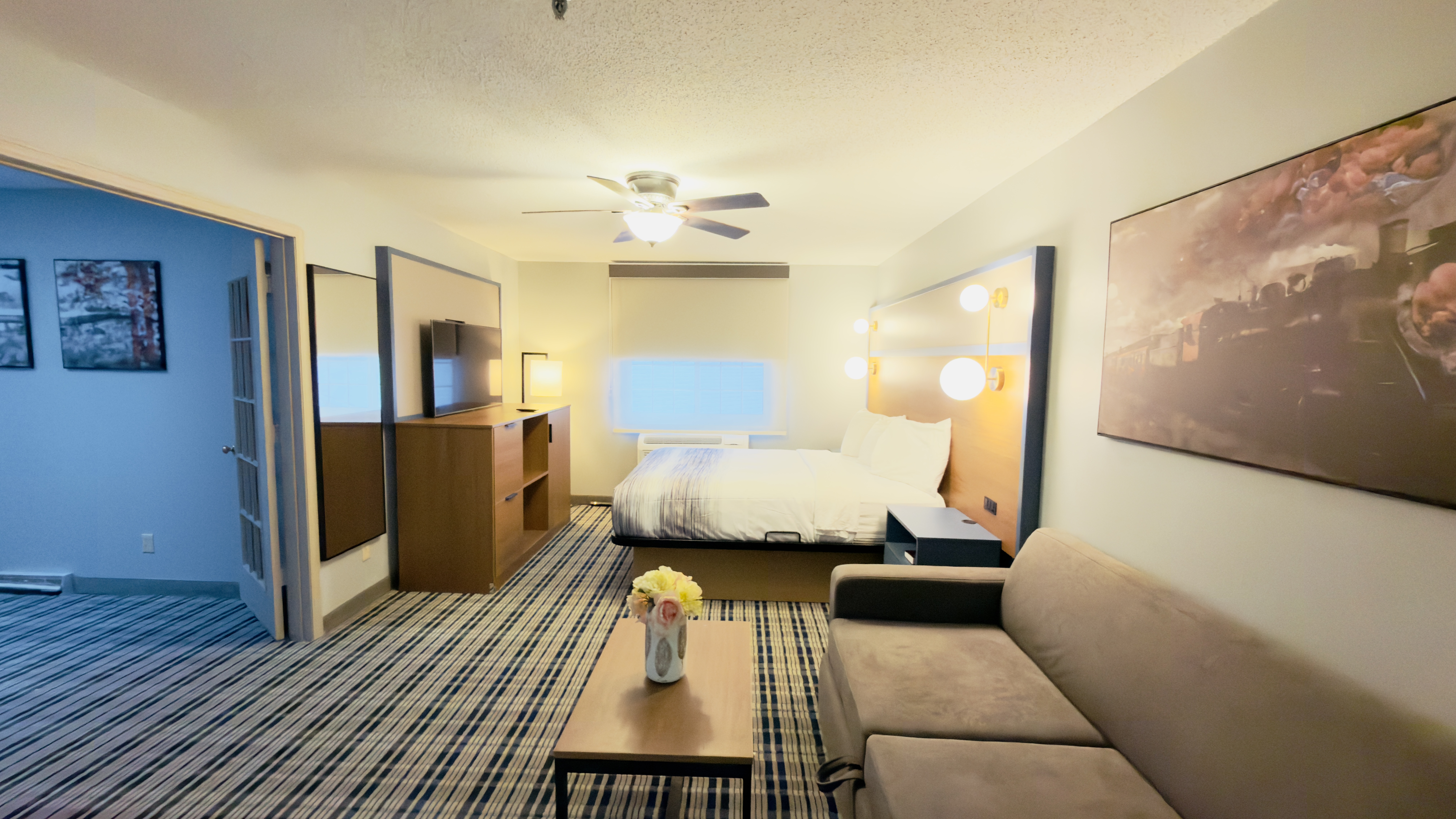 Guest room at the AmericInn by Wyndham Lake Mills in Lake Mills, Wisconsin