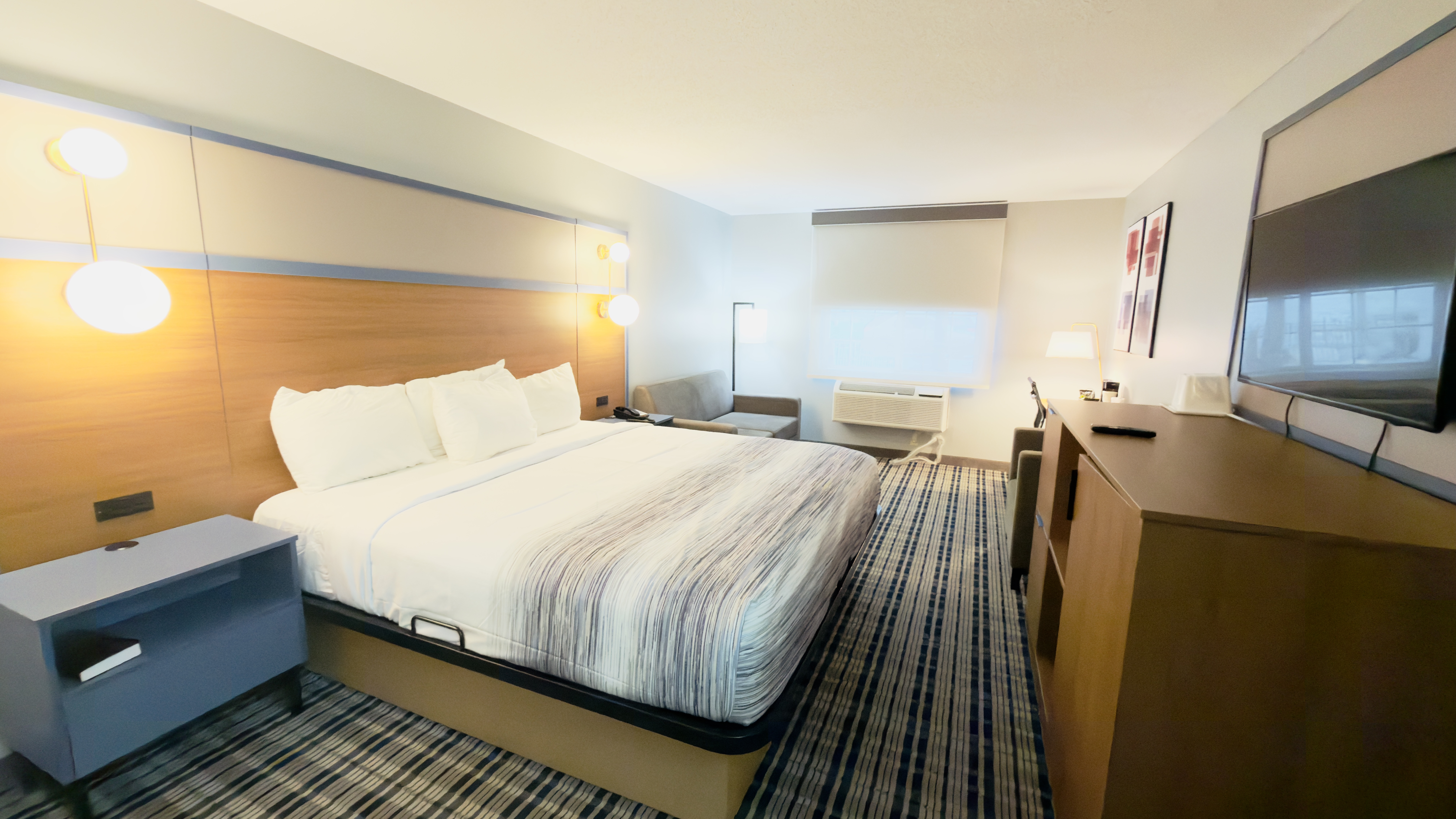 Guest room at the AmericInn by Wyndham Lake Mills in Lake Mills, Wisconsin