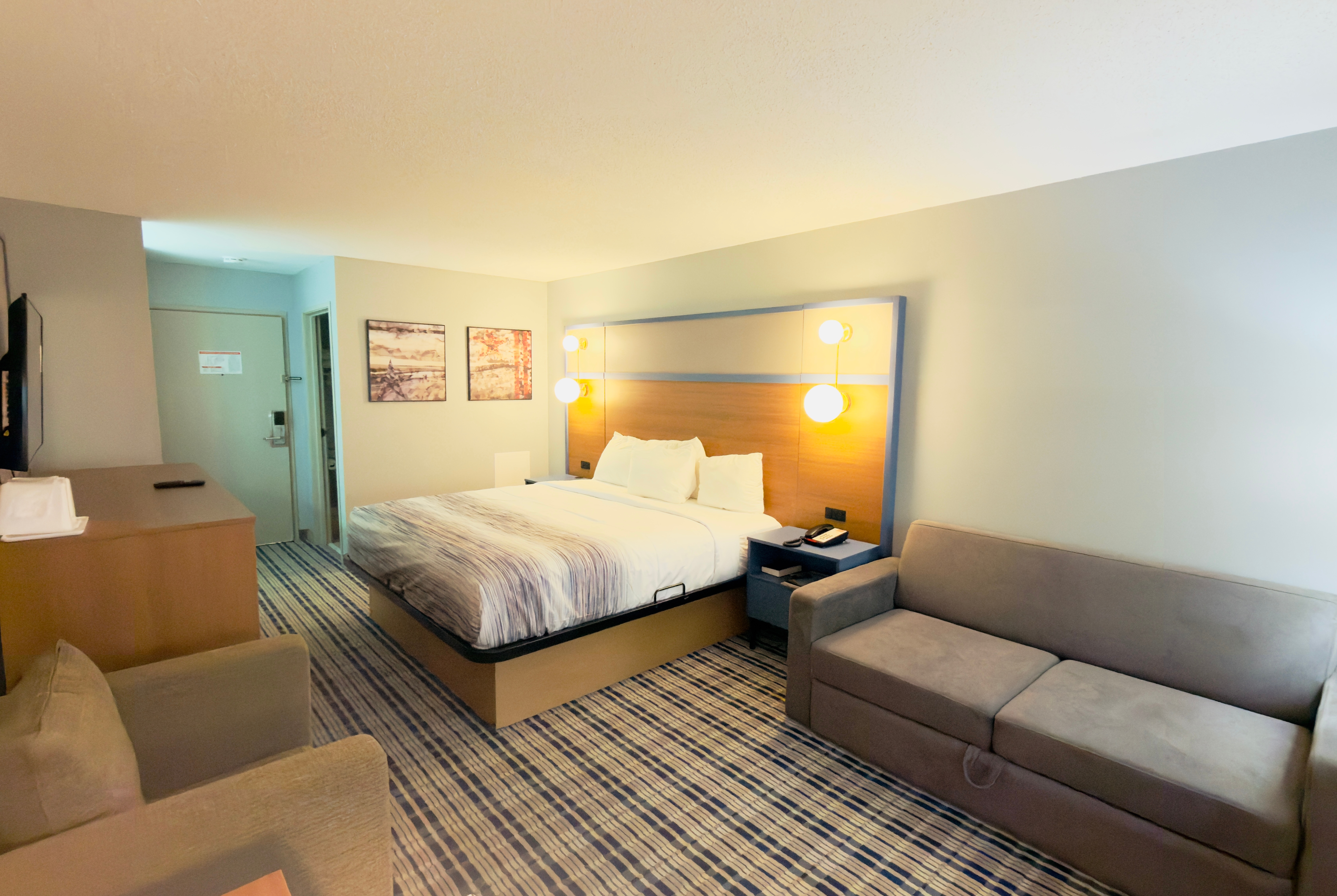 Guest room at the AmericInn by Wyndham Lake Mills in Lake Mills, Wisconsin