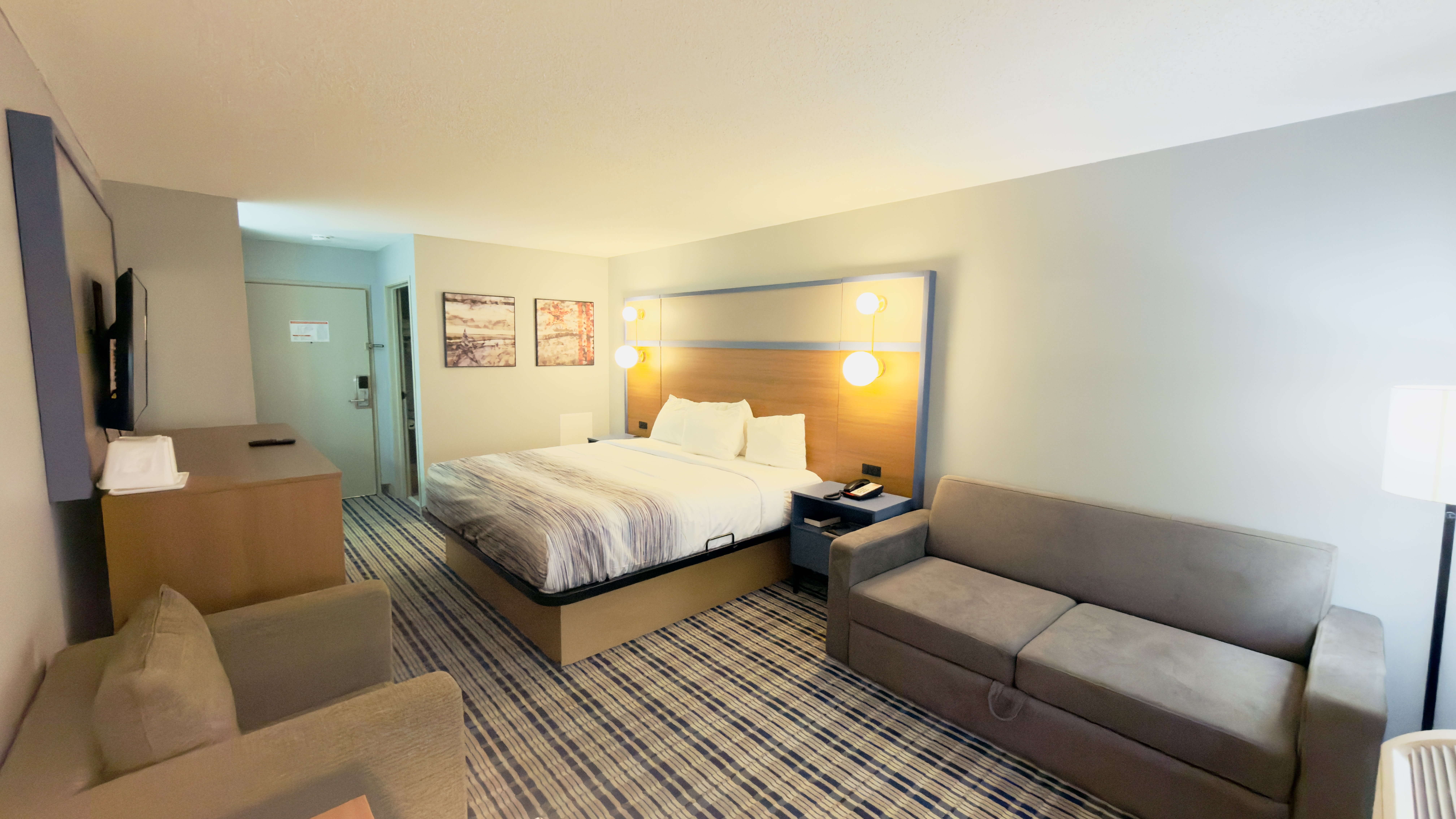 Guest room at the AmericInn by Wyndham Lake Mills in Lake Mills, Wisconsin