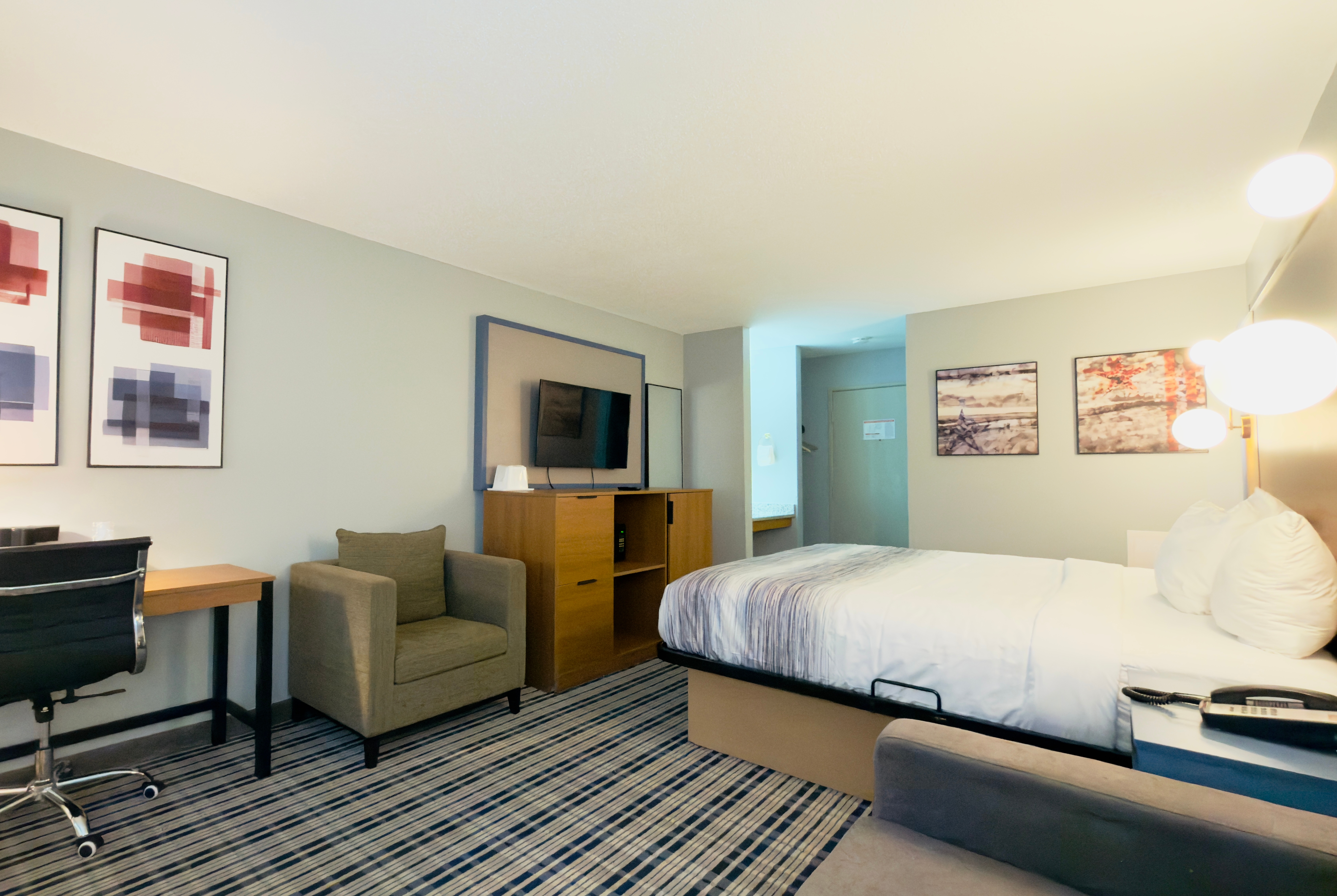 Guest room at the AmericInn by Wyndham Lake Mills in Lake Mills, Wisconsin