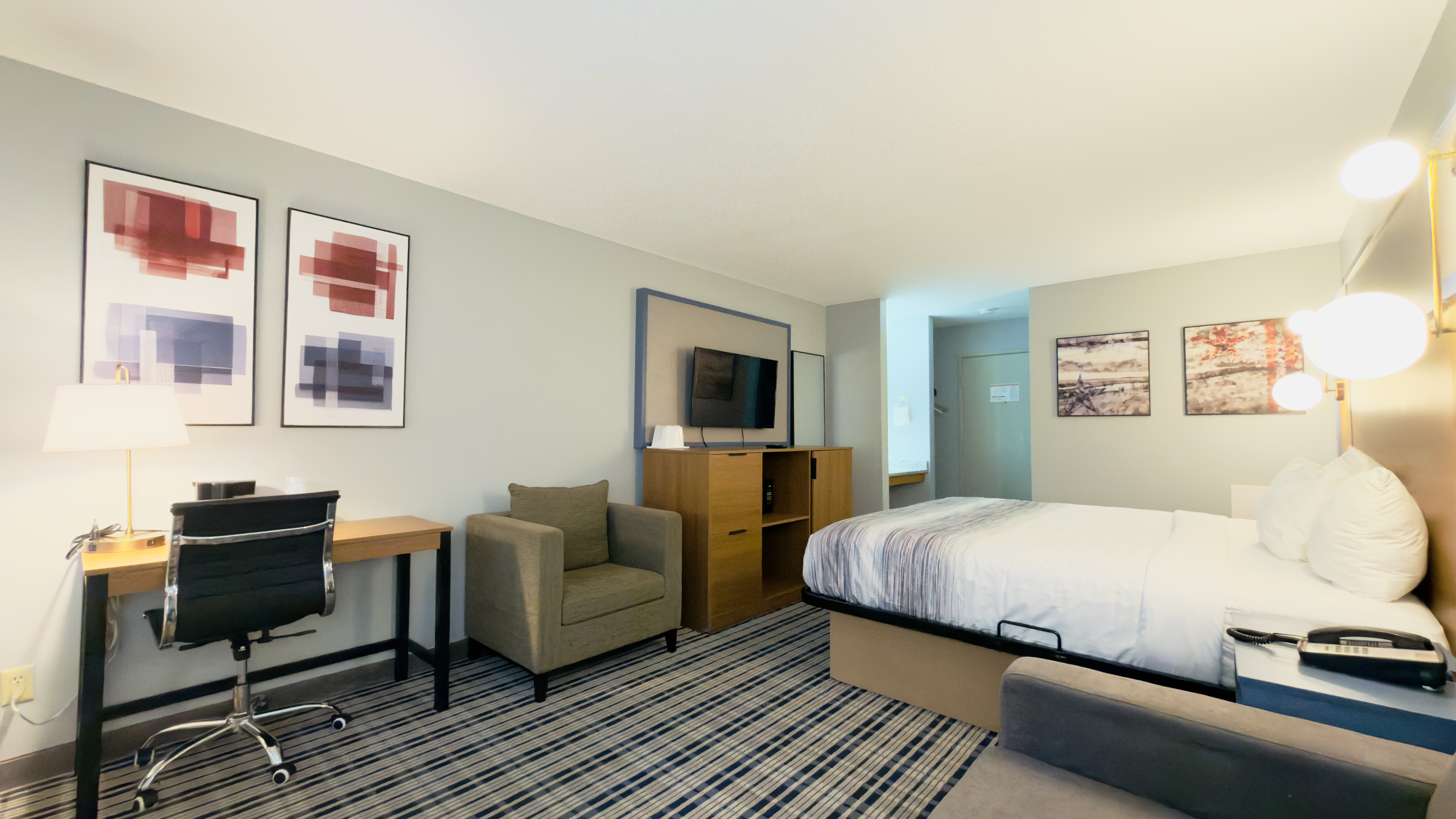 Guest room at the AmericInn by Wyndham Lake Mills in Lake Mills, Wisconsin