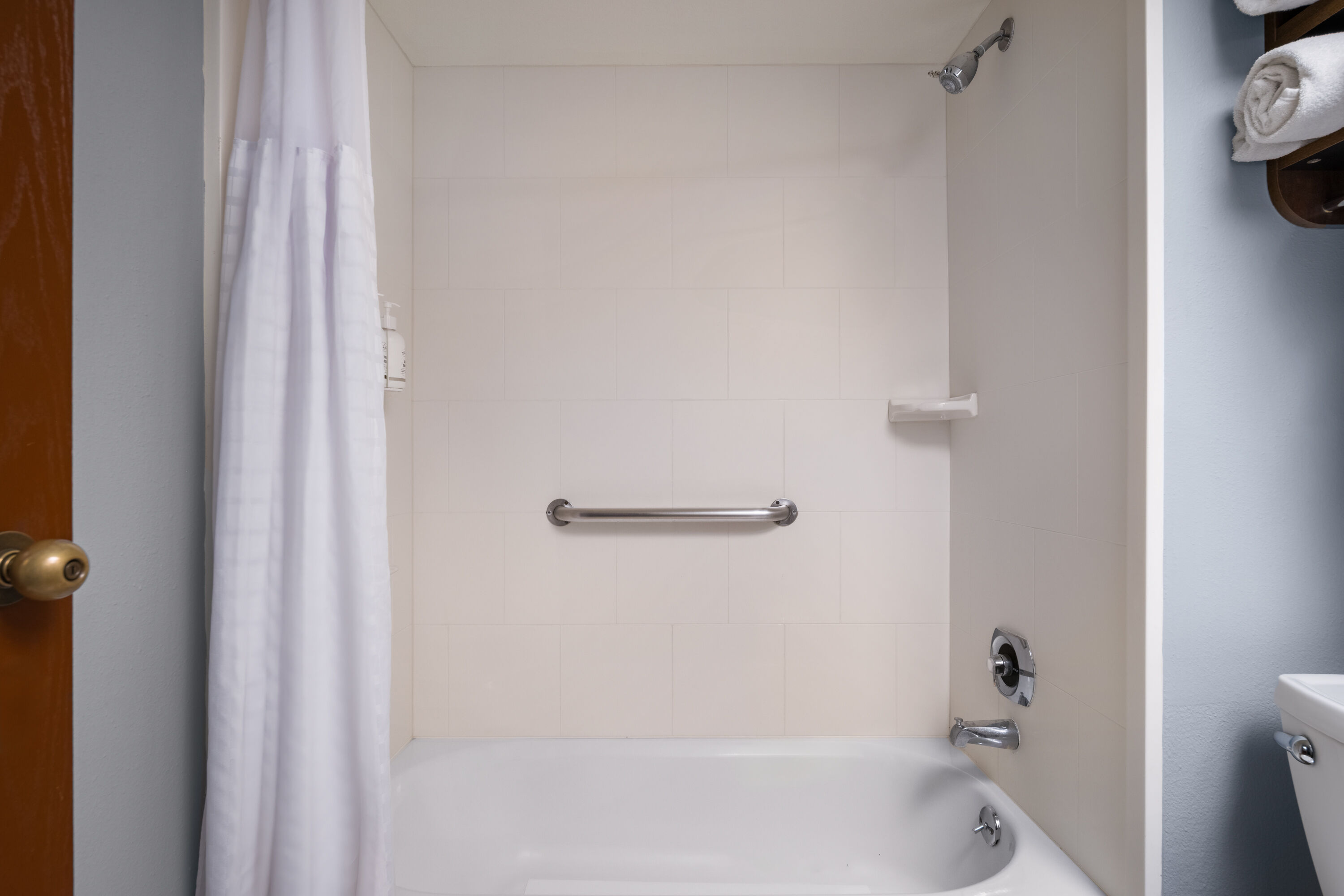 Guest room bath at the AmericInn by Wyndham Madison West in Madison, Wisconsin