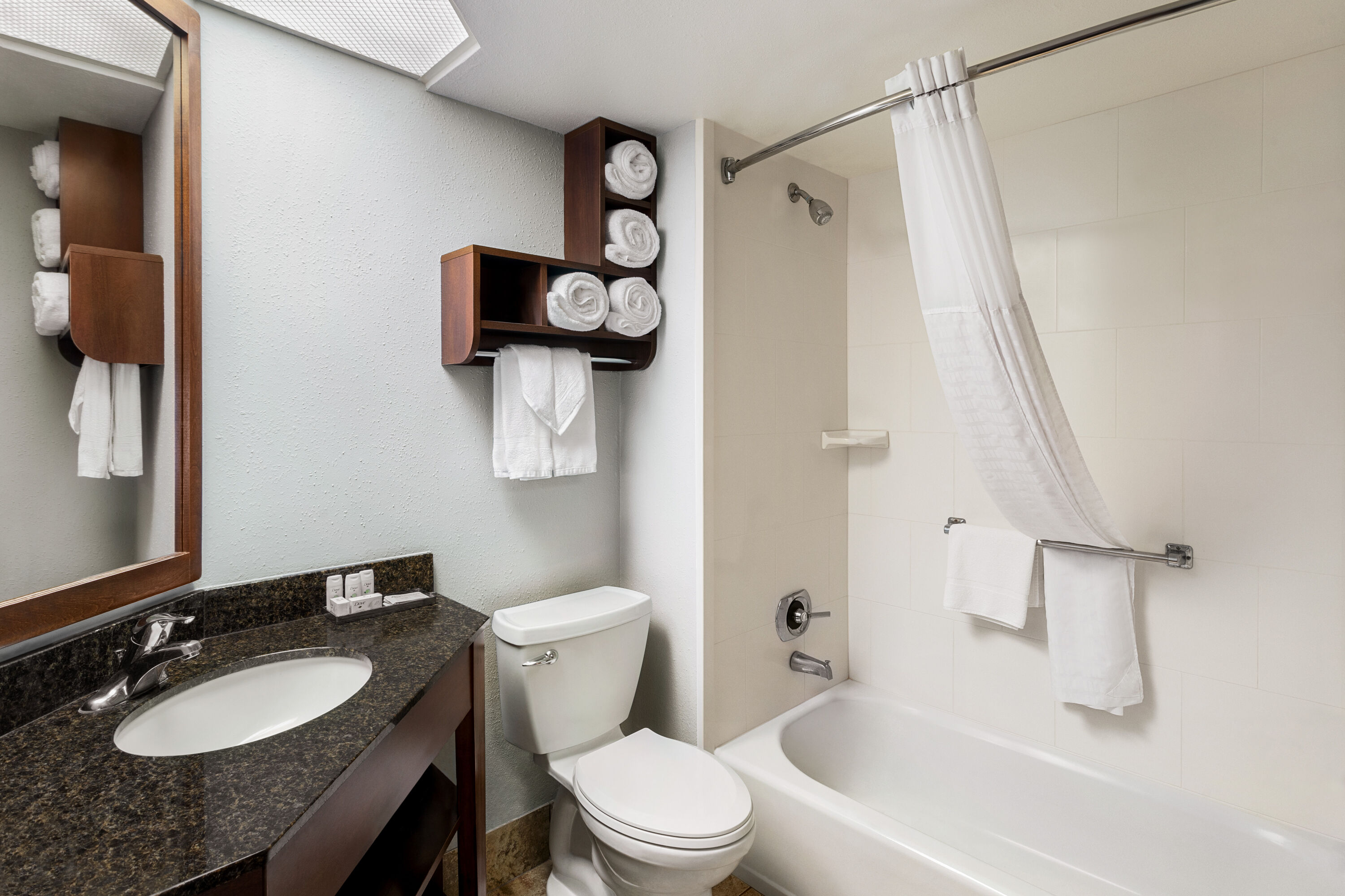 Guest room bath at the AmericInn by Wyndham Madison West in Madison, Wisconsin