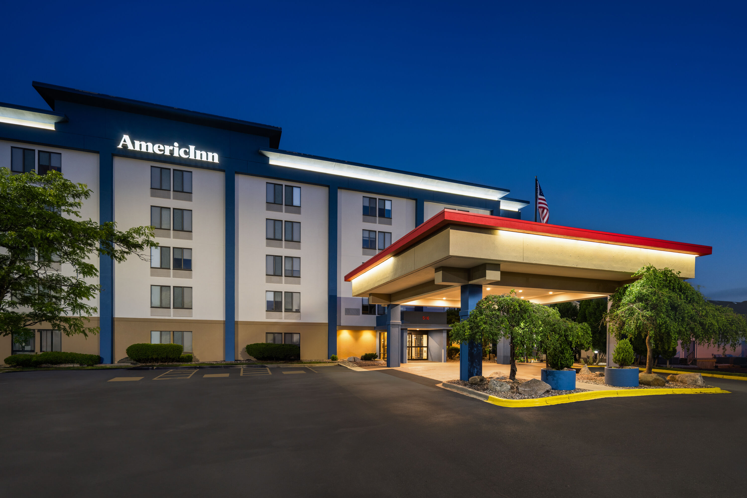 Exterior Dusk Image of AmericInn by Wyndham Madison West hotel in Madison, Wisconsin