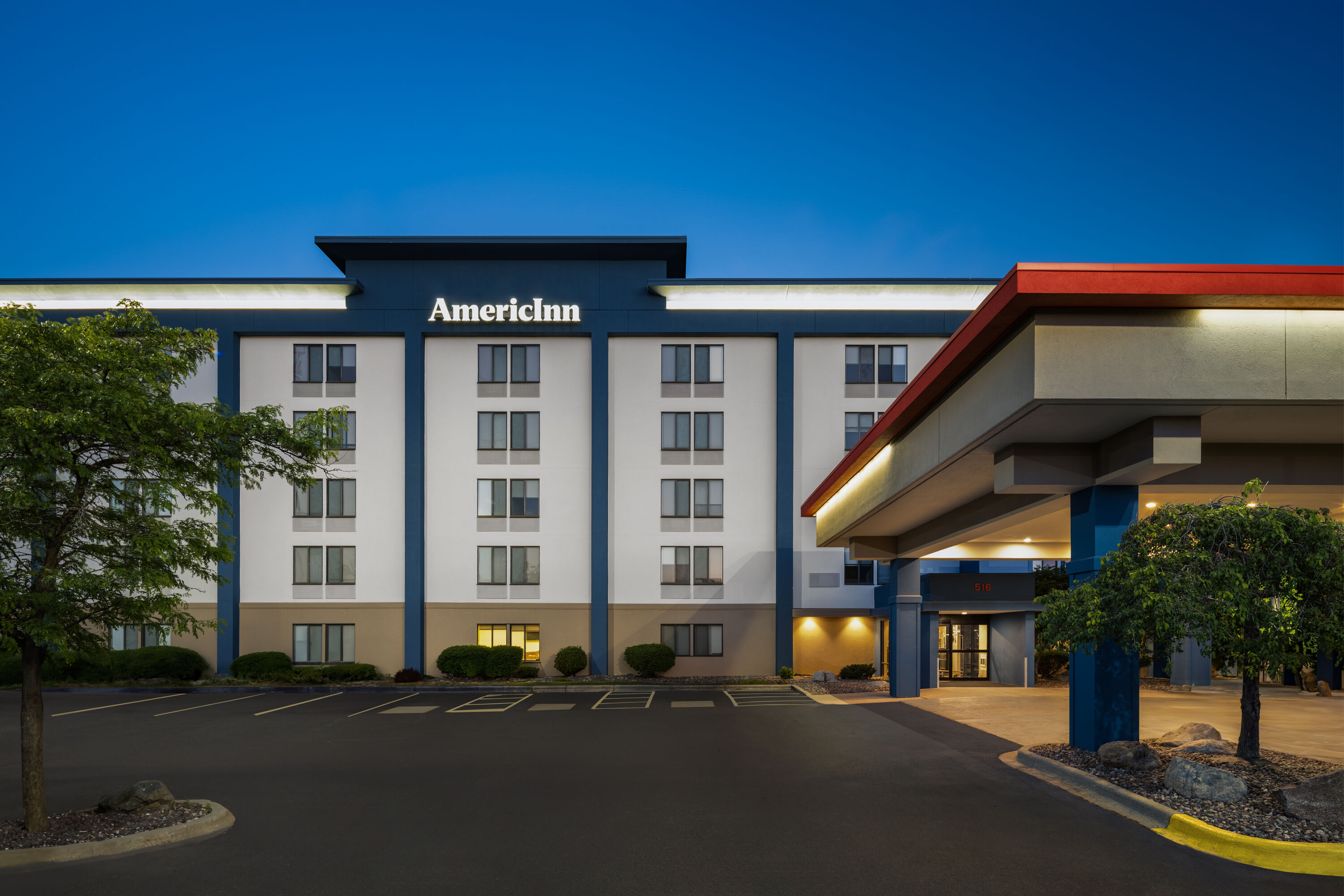 Exterior Dusk Image of AmericInn by Wyndham Madison West hotel in Madison, Wisconsin