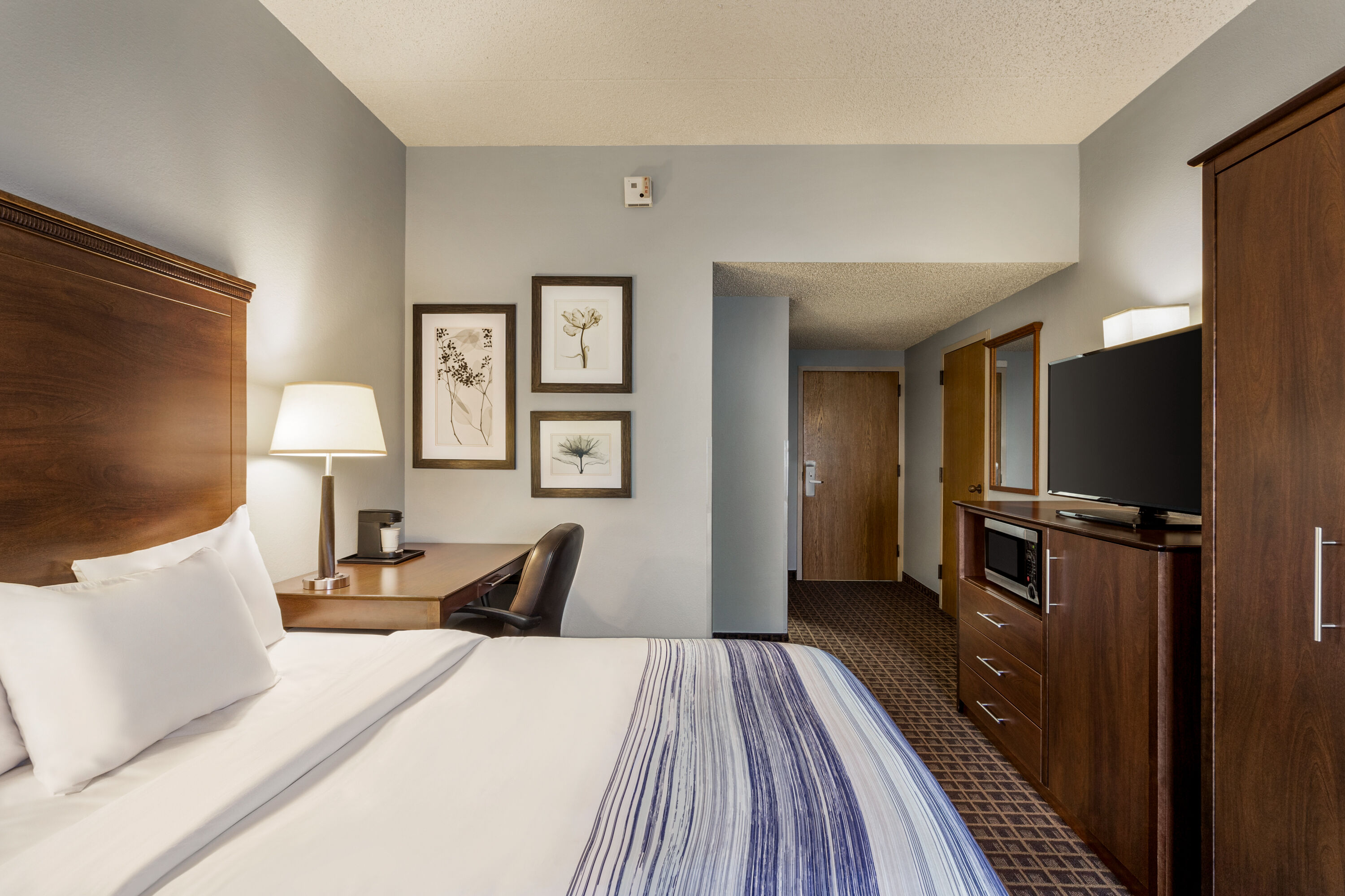 Guest room at the AmericInn by Wyndham Madison West in Madison, Wisconsin