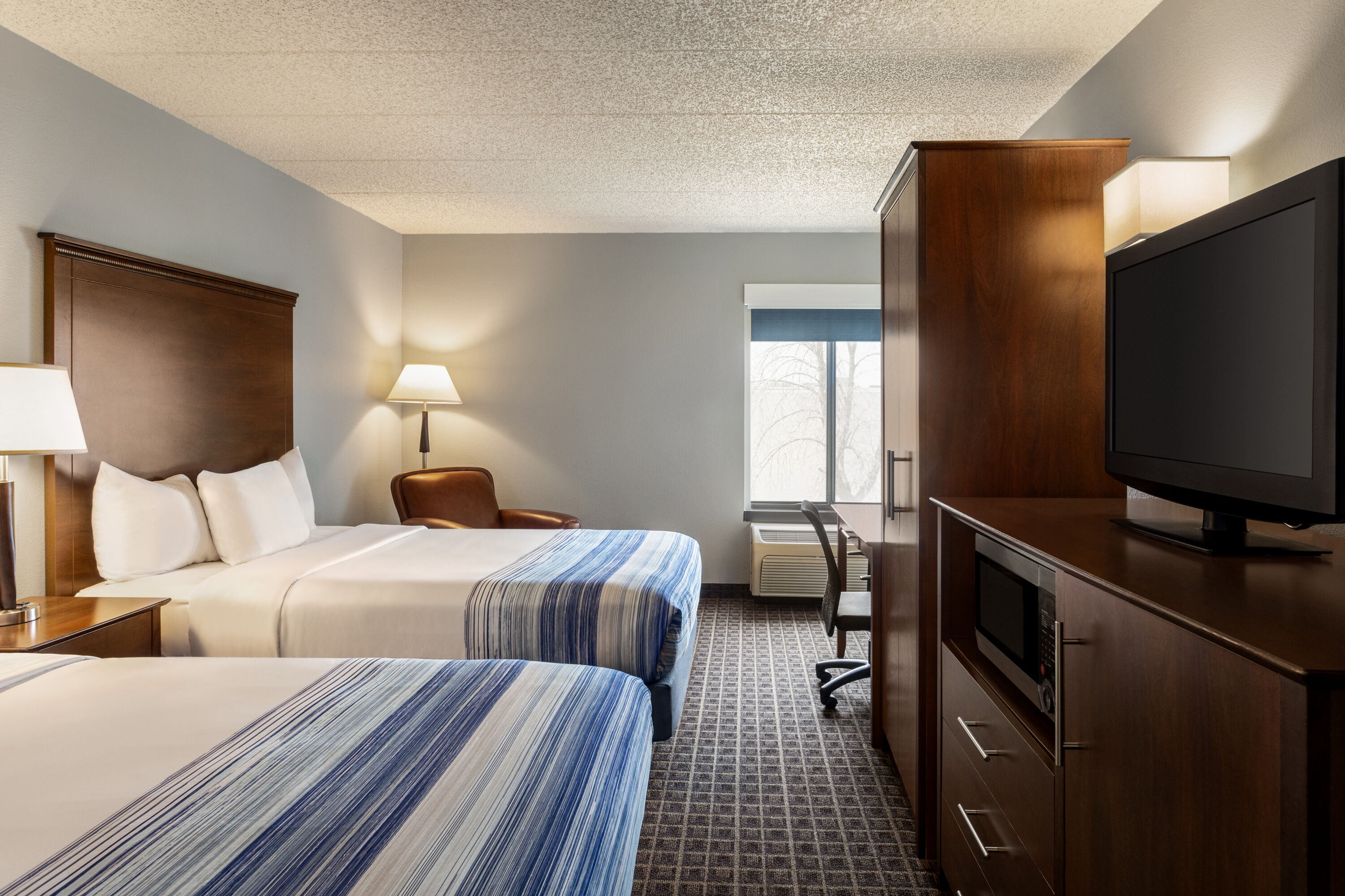 Guest room at the AmericInn by Wyndham Madison West in Madison, Wisconsin