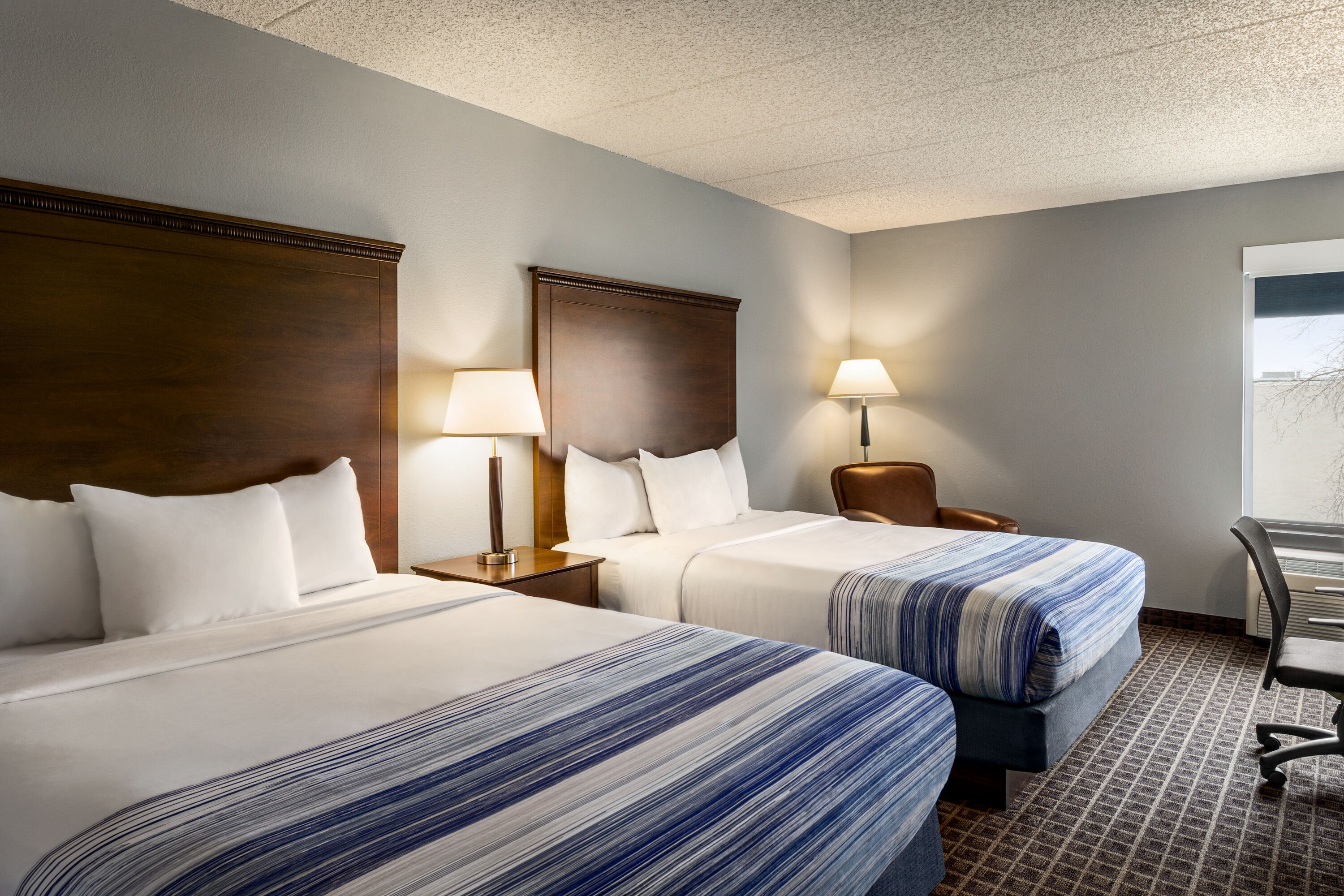 Guest room at the AmericInn by Wyndham Madison West in Madison, Wisconsin