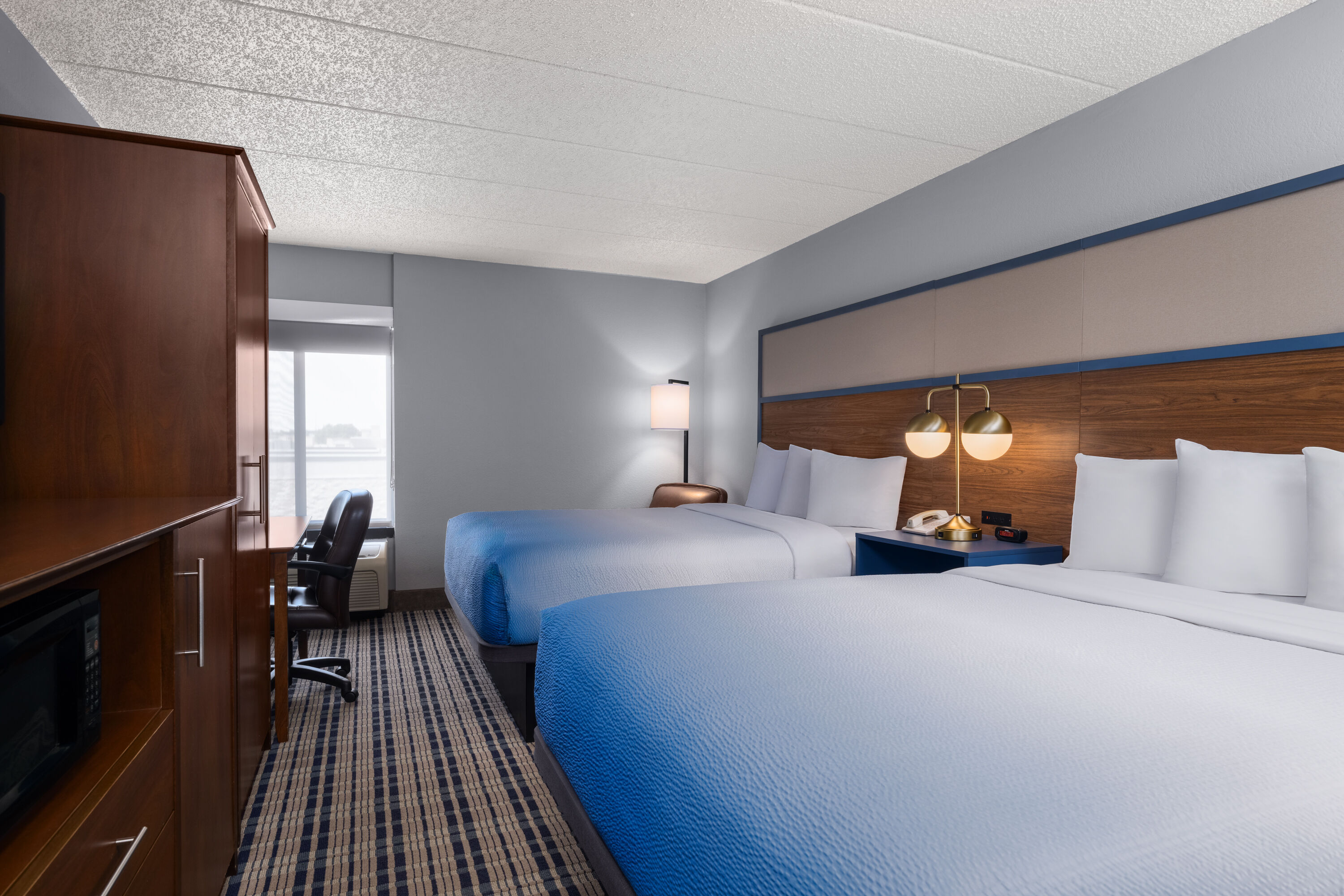 Guest room at the AmericInn by Wyndham Madison West in Madison, Wisconsin