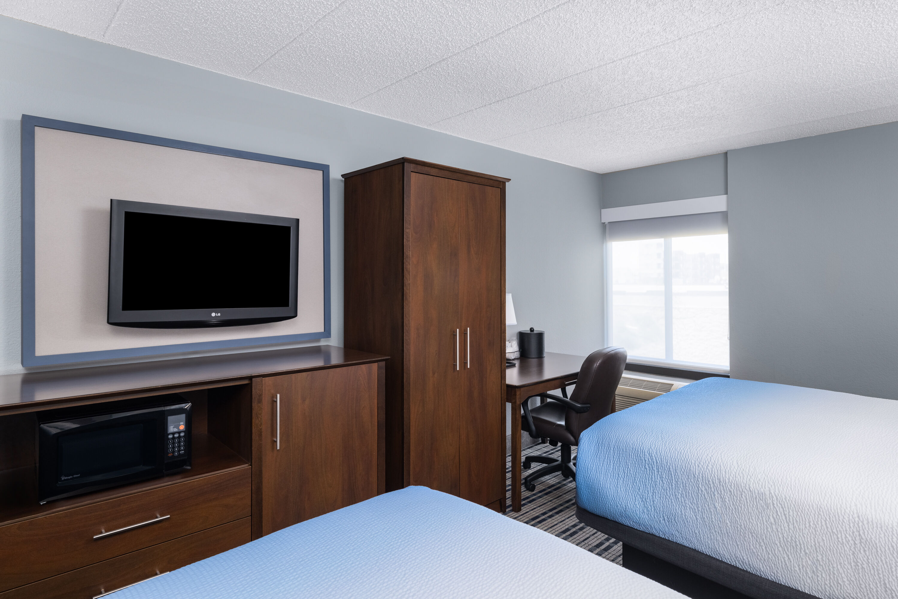 Guest room at the AmericInn by Wyndham Madison West in Madison, Wisconsin