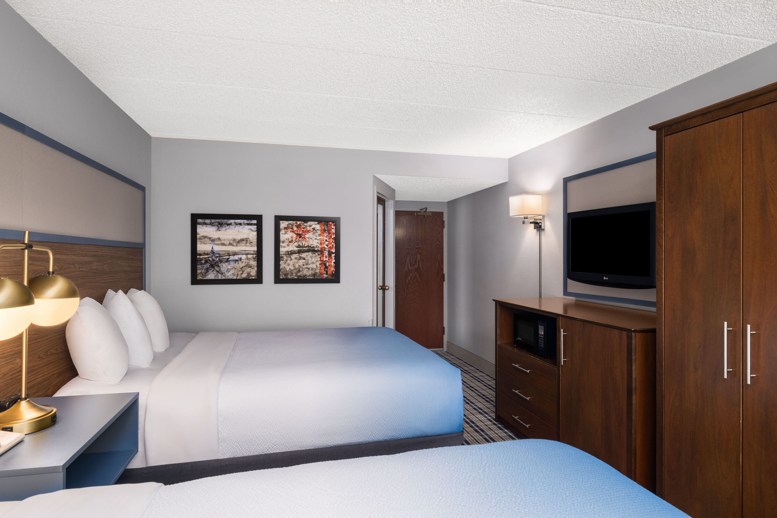 Guest room at the AmericInn by Wyndham Madison West in Madison, Wisconsin