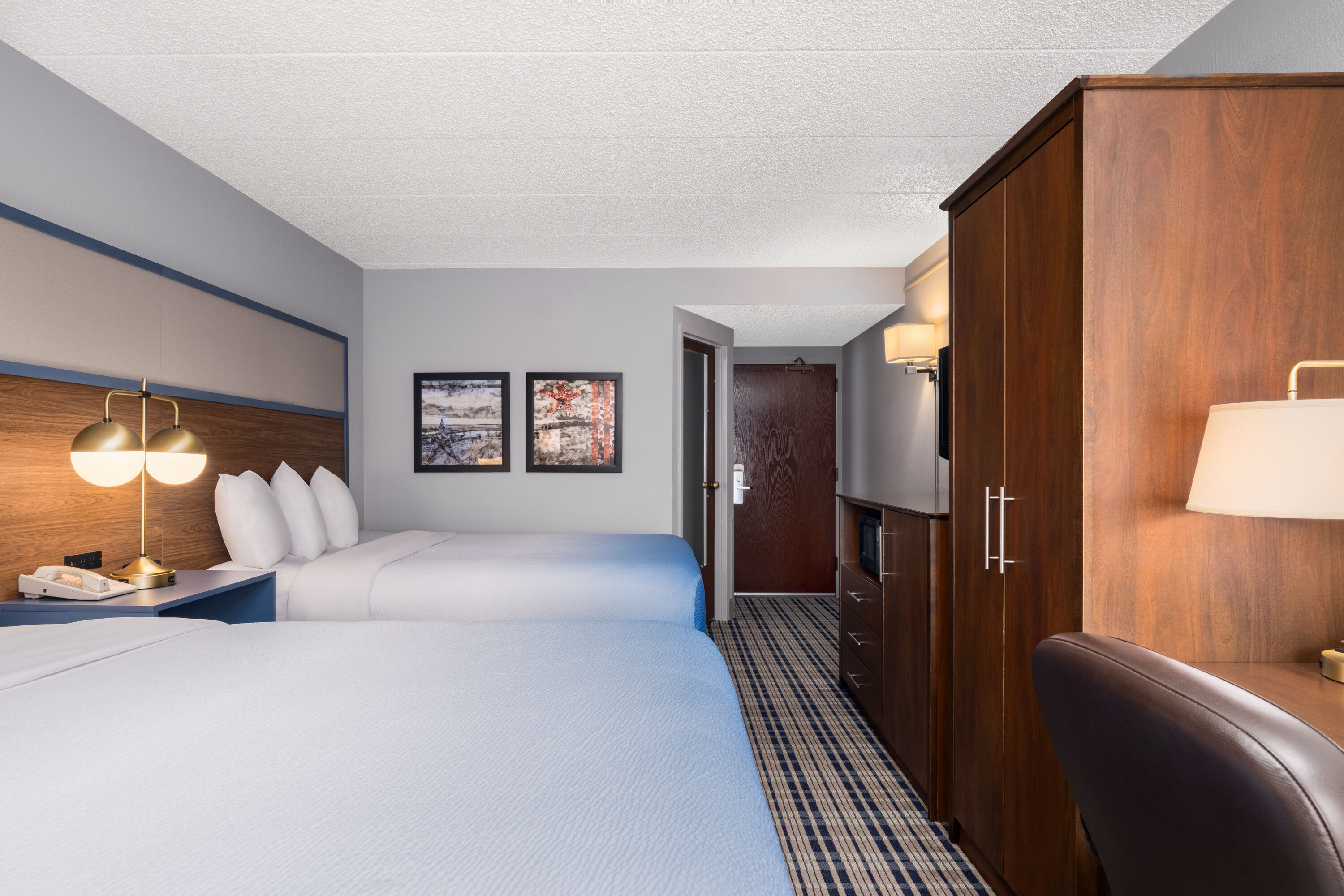 Guest room at the AmericInn by Wyndham Madison West in Madison, Wisconsin