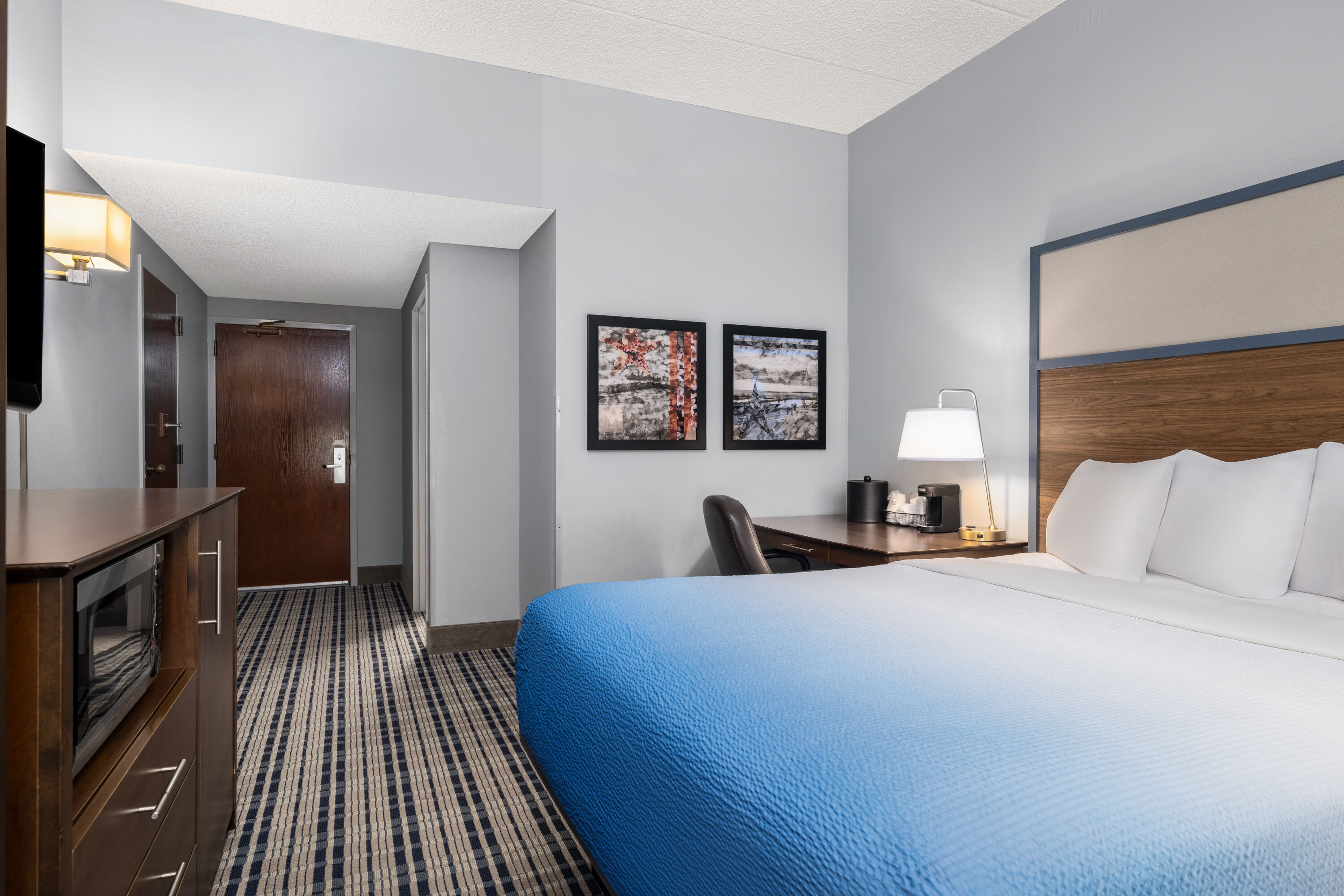 Guest room at the AmericInn by Wyndham Madison West in Madison, Wisconsin