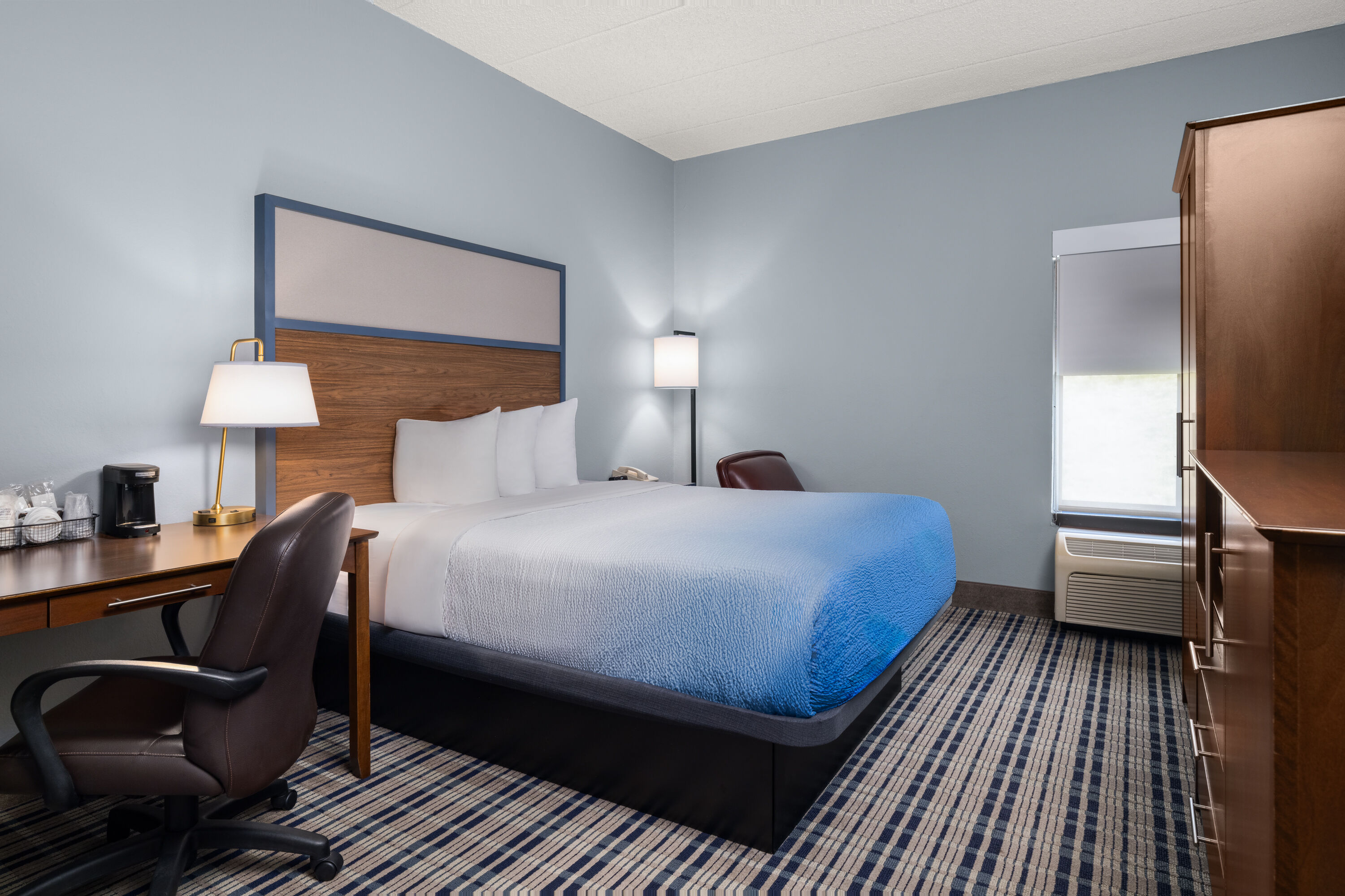 Guest room at the AmericInn by Wyndham Madison West in Madison, Wisconsin
