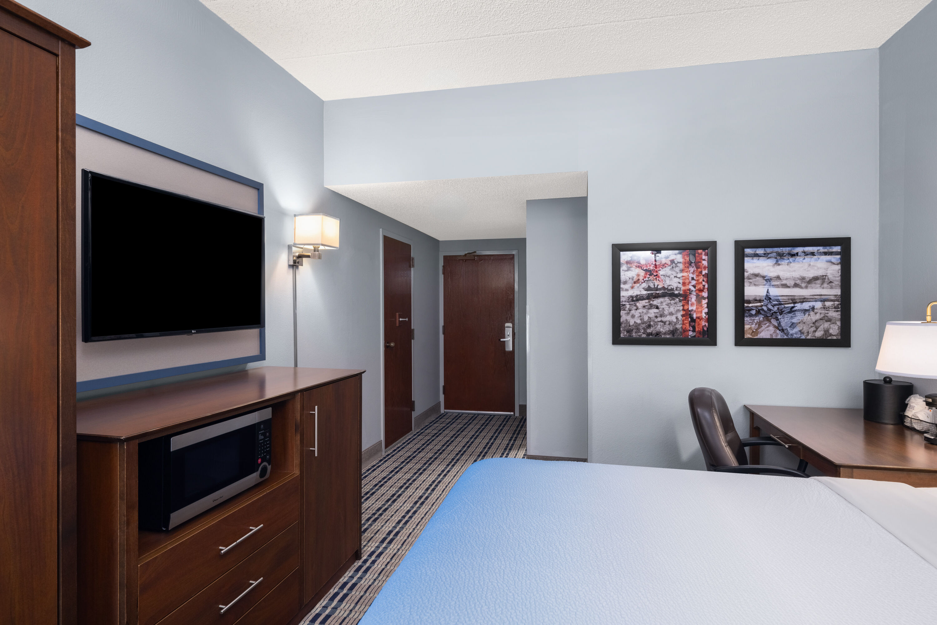 Guest room at the AmericInn by Wyndham Madison West in Madison, Wisconsin