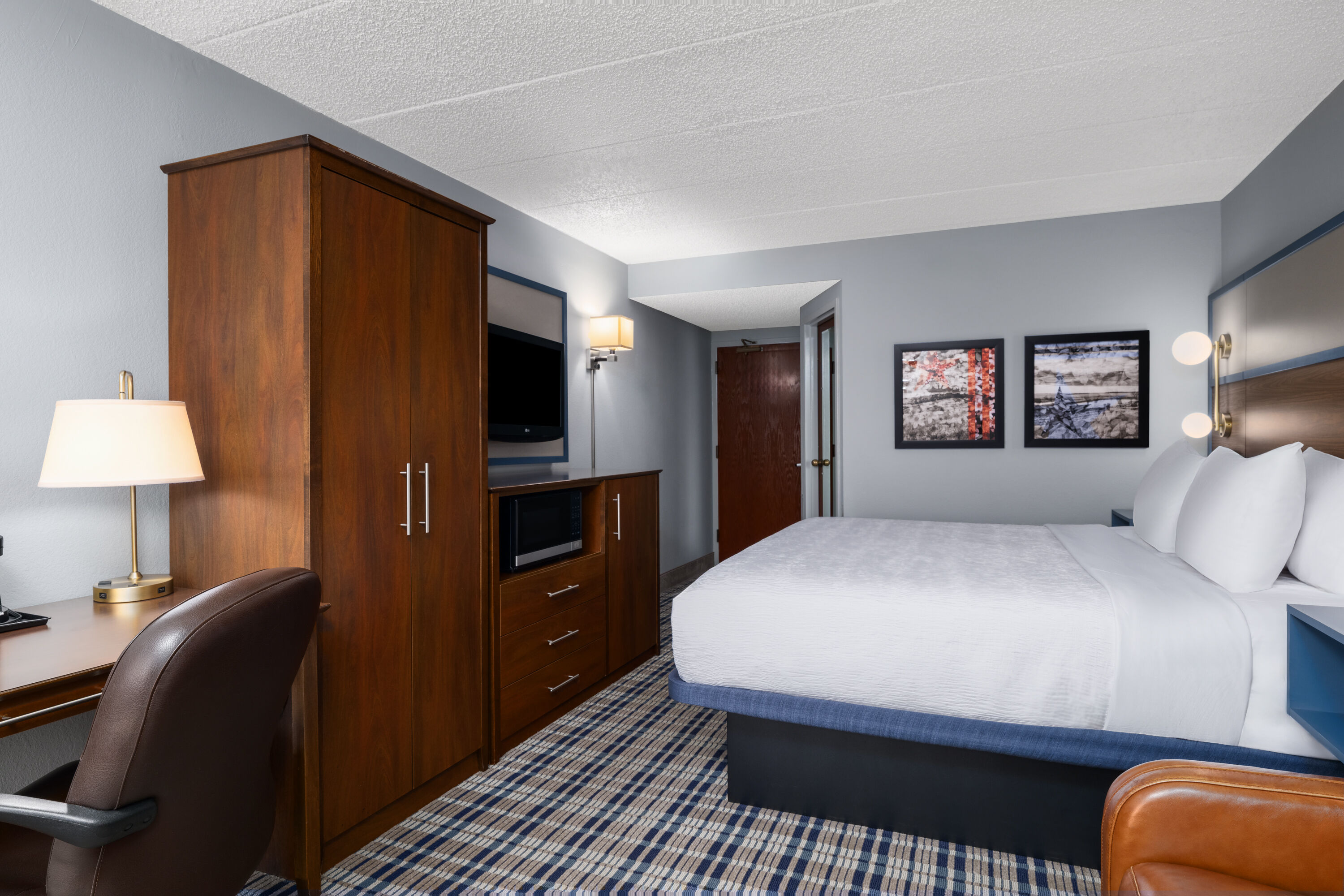 Guest room at the AmericInn by Wyndham Madison West in Madison, Wisconsin