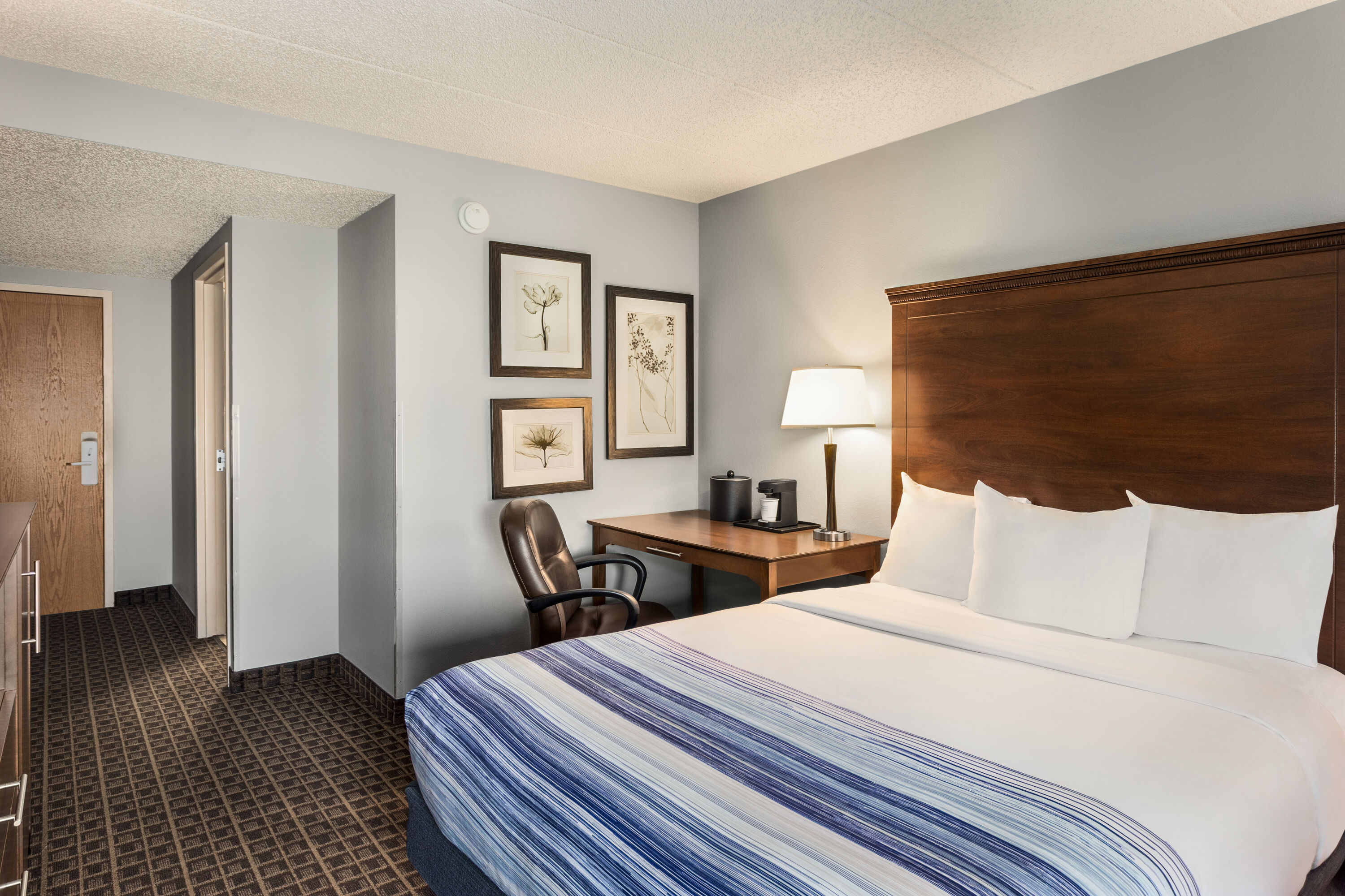 Guest room at the AmericInn by Wyndham Madison West in Madison, Wisconsin