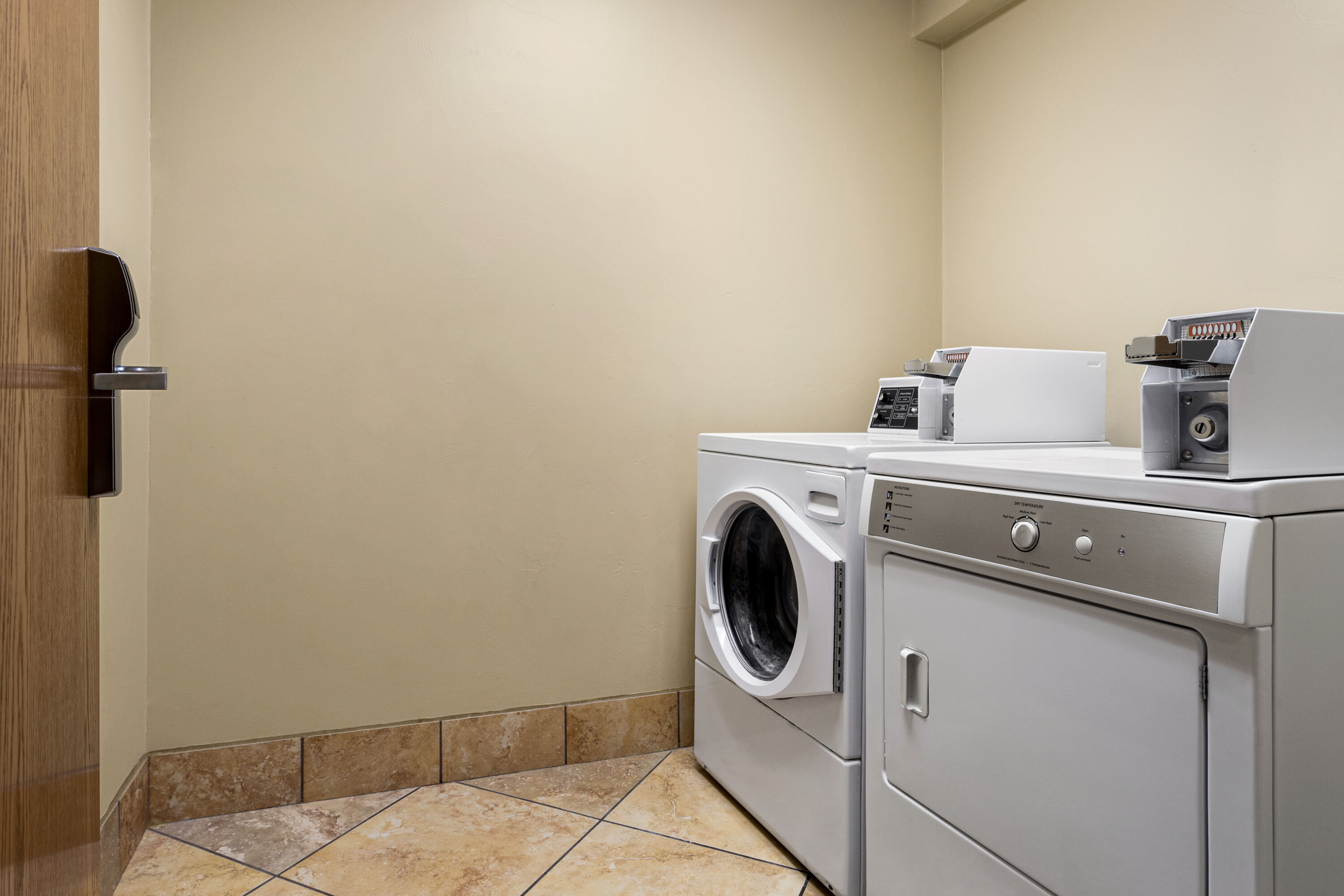 Laundry facilities at AmericInn by Wyndham Madison West in Madison, Wisconsin