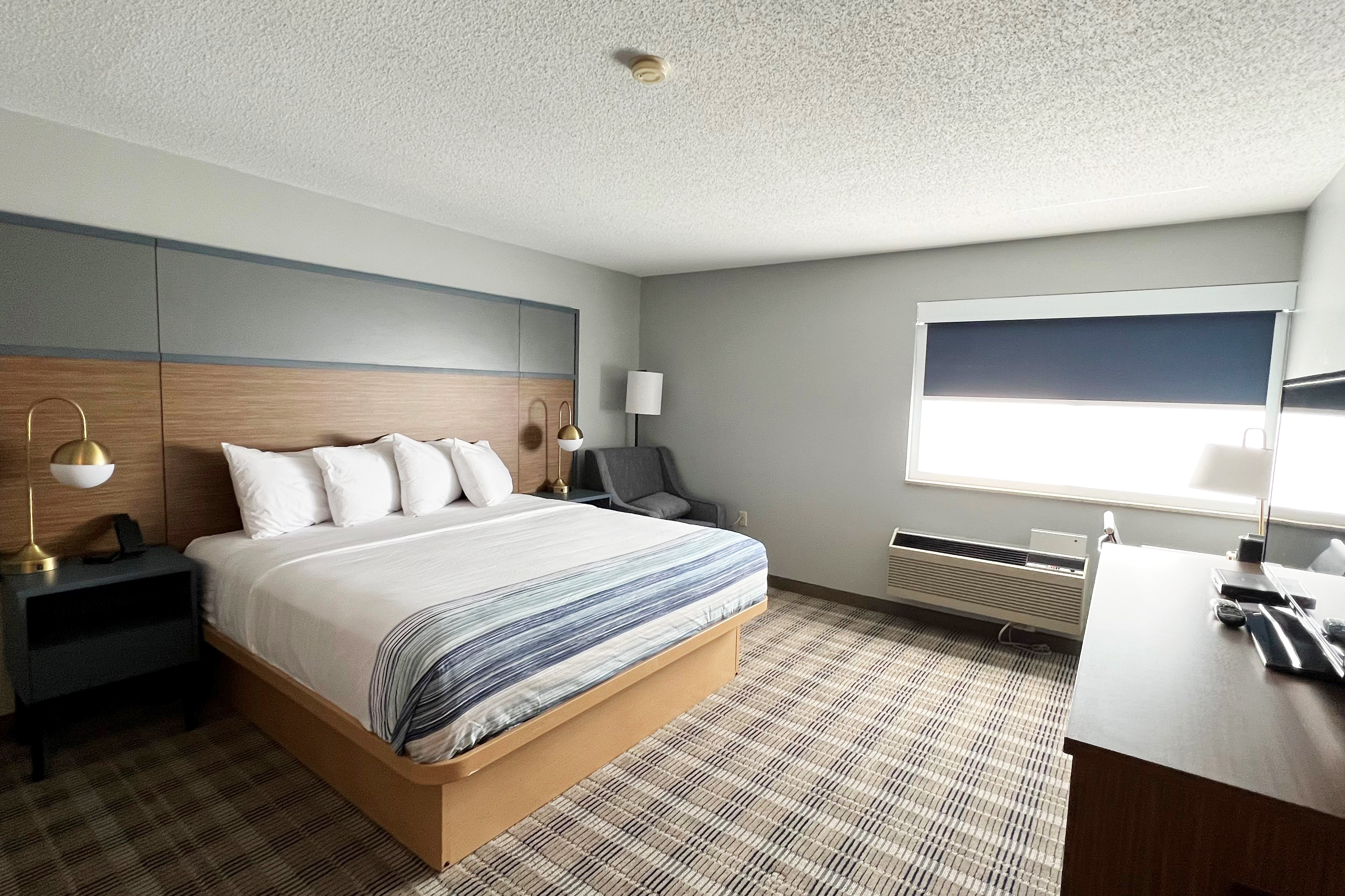 Guest room at the AmericInn by Wyndham Marshfield in Marshfield, Wisconsin
