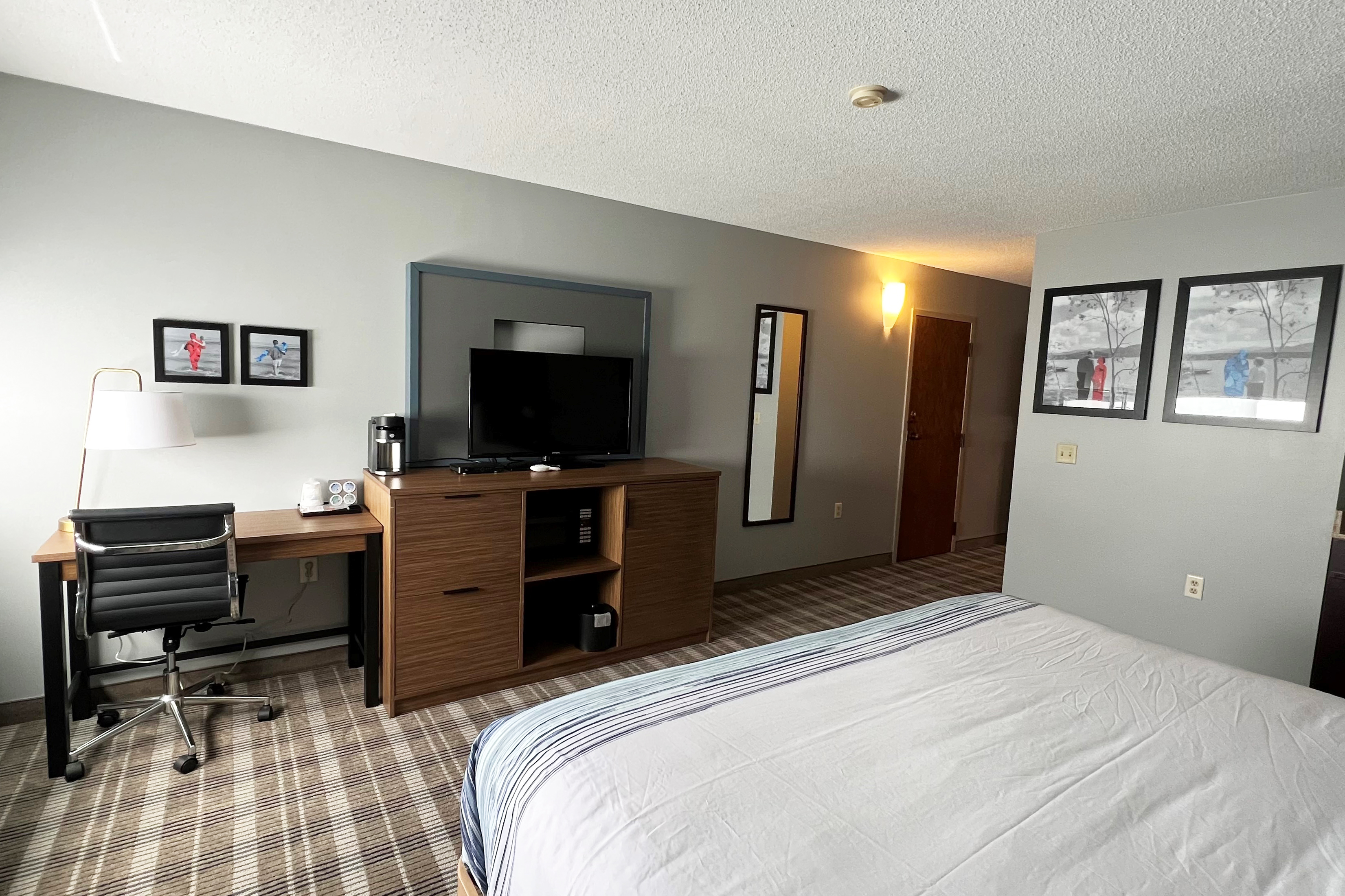 Guest room at the AmericInn by Wyndham Marshfield in Marshfield, Wisconsin