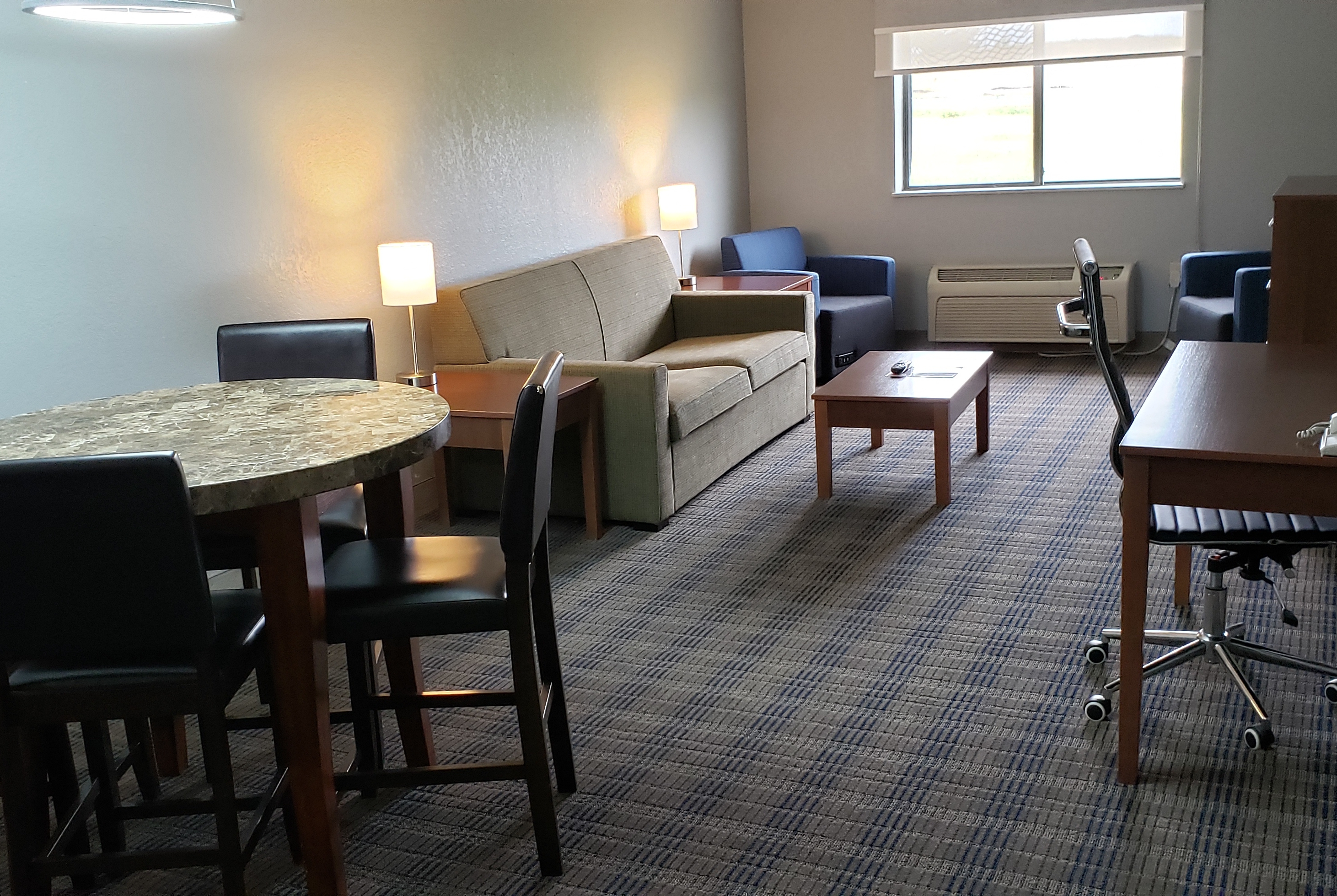Guest room at the AmericInn by Wyndham Mauston in Mauston, Wisconsin