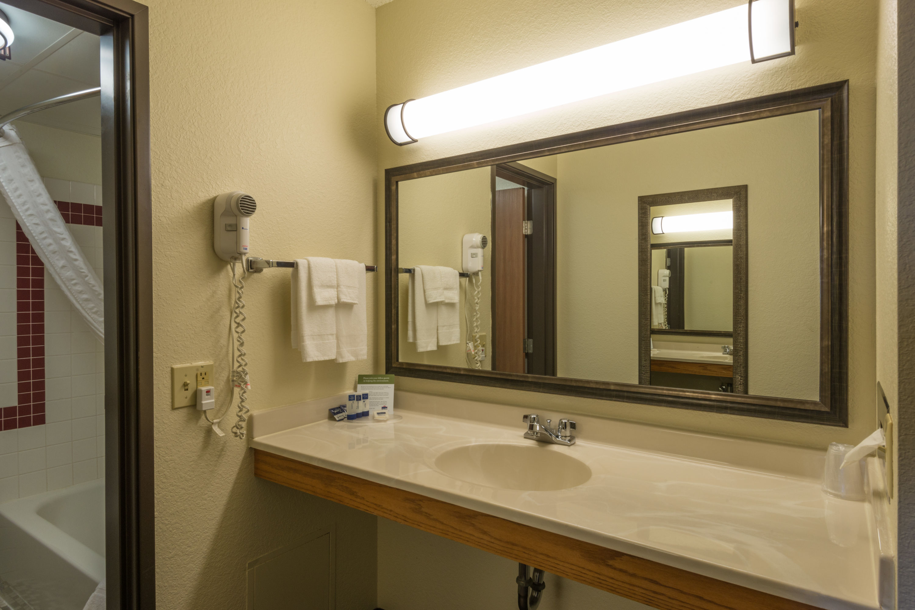 Guest room bath at the AmericInn by Wyndham Minocqua in Minocqua, Wisconsin