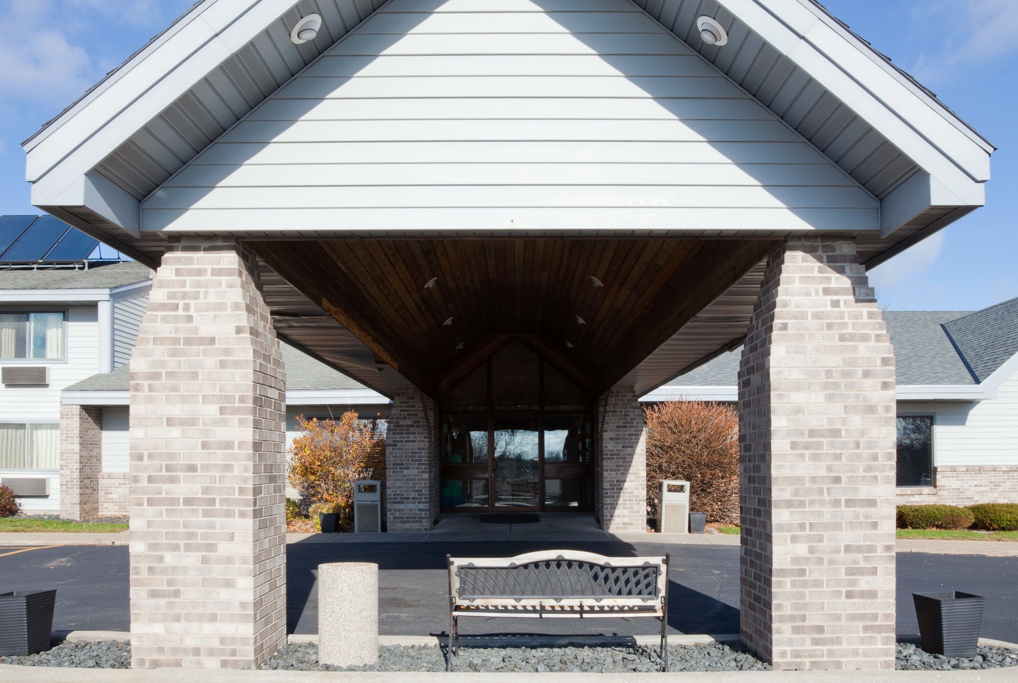 Exterior Day Image of AmericInn by Wyndham Monroe hotel in Monroe, Wisconsin