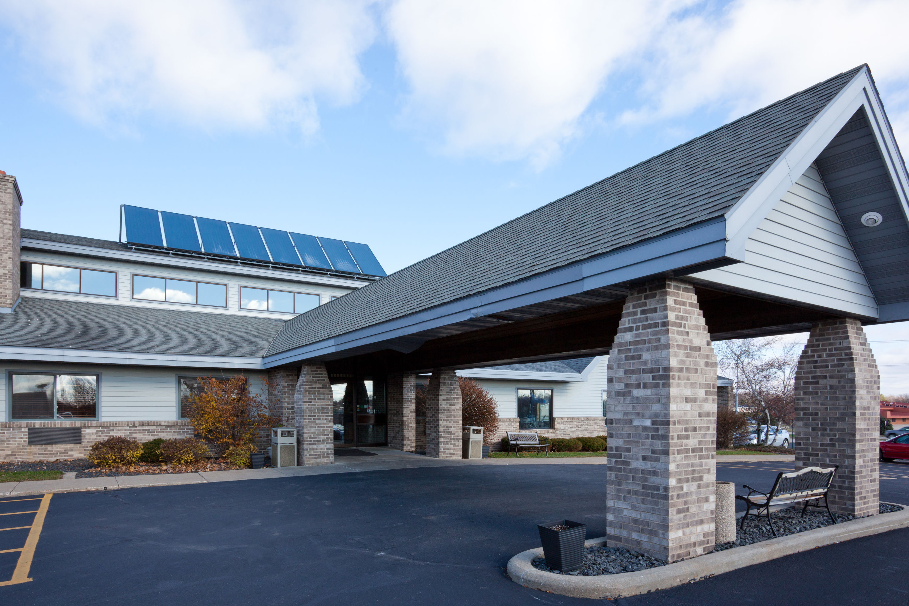 Exterior Day Image of AmericInn by Wyndham Monroe hotel in Monroe, Wisconsin