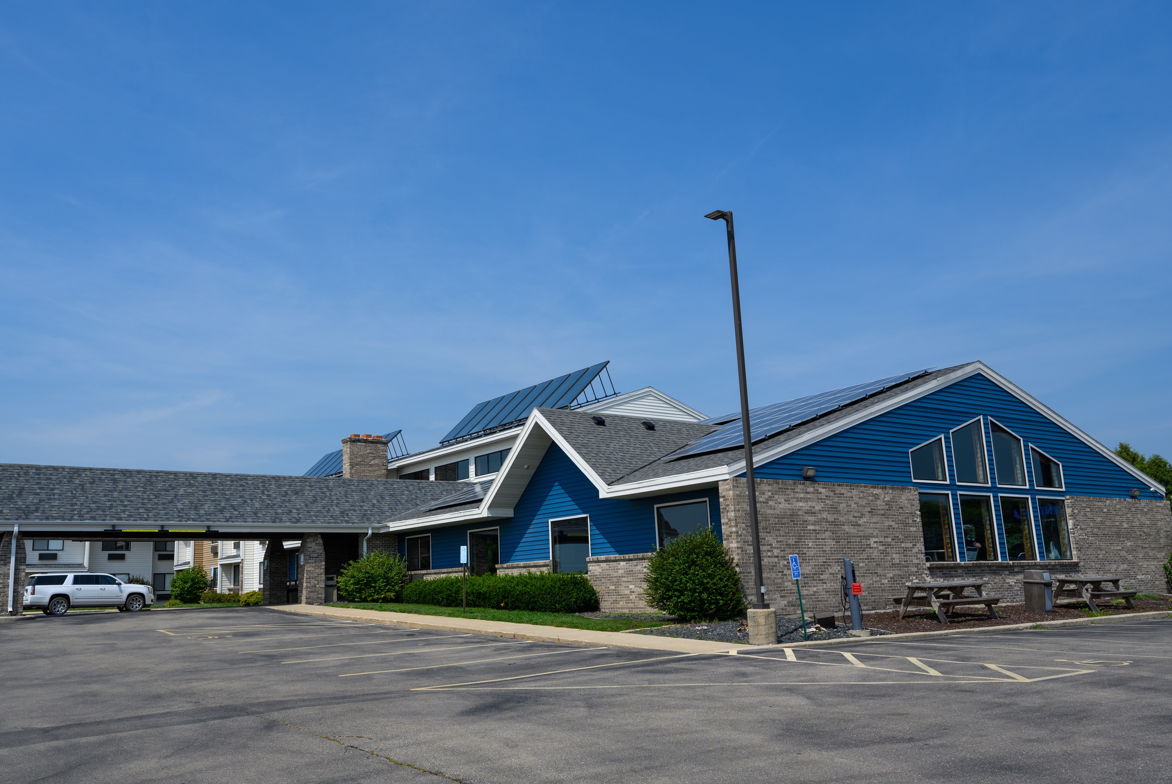 Exterior of AmericInn by Wyndham Monroe hotel in Monroe, Wisconsin