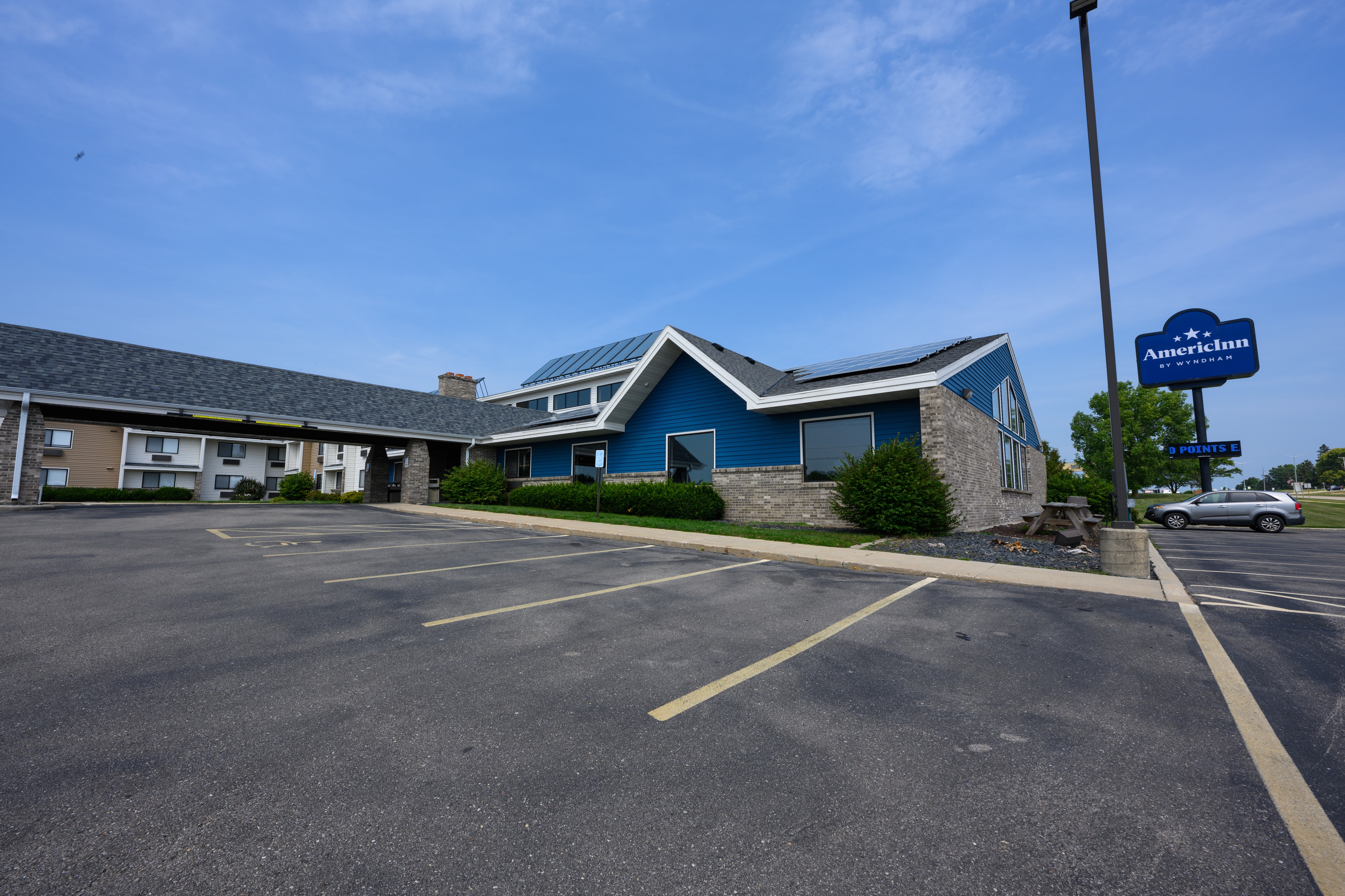 Exterior of AmericInn by Wyndham Monroe hotel in Monroe, Wisconsin