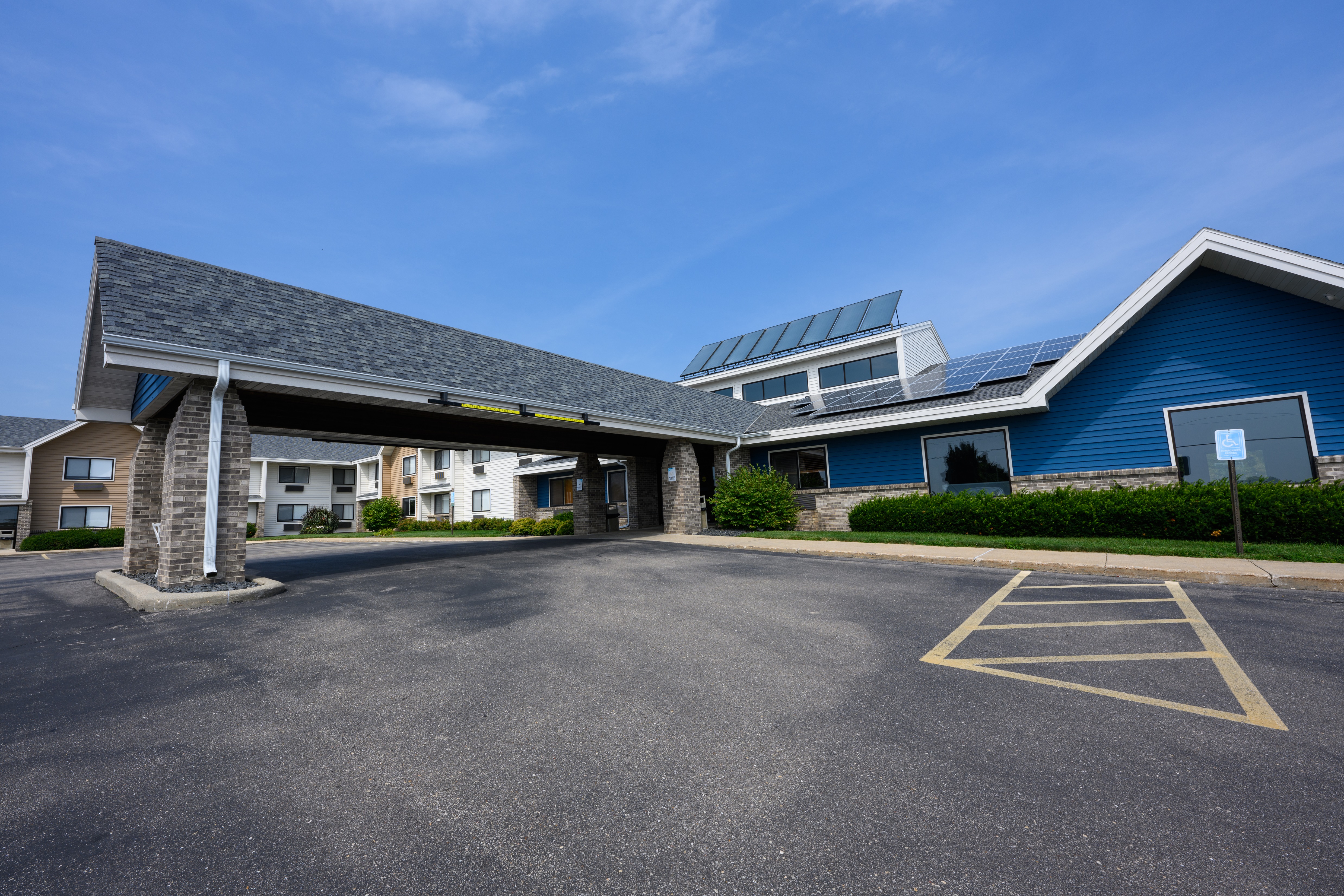Exterior of AmericInn by Wyndham Monroe hotel in Monroe, Wisconsin
