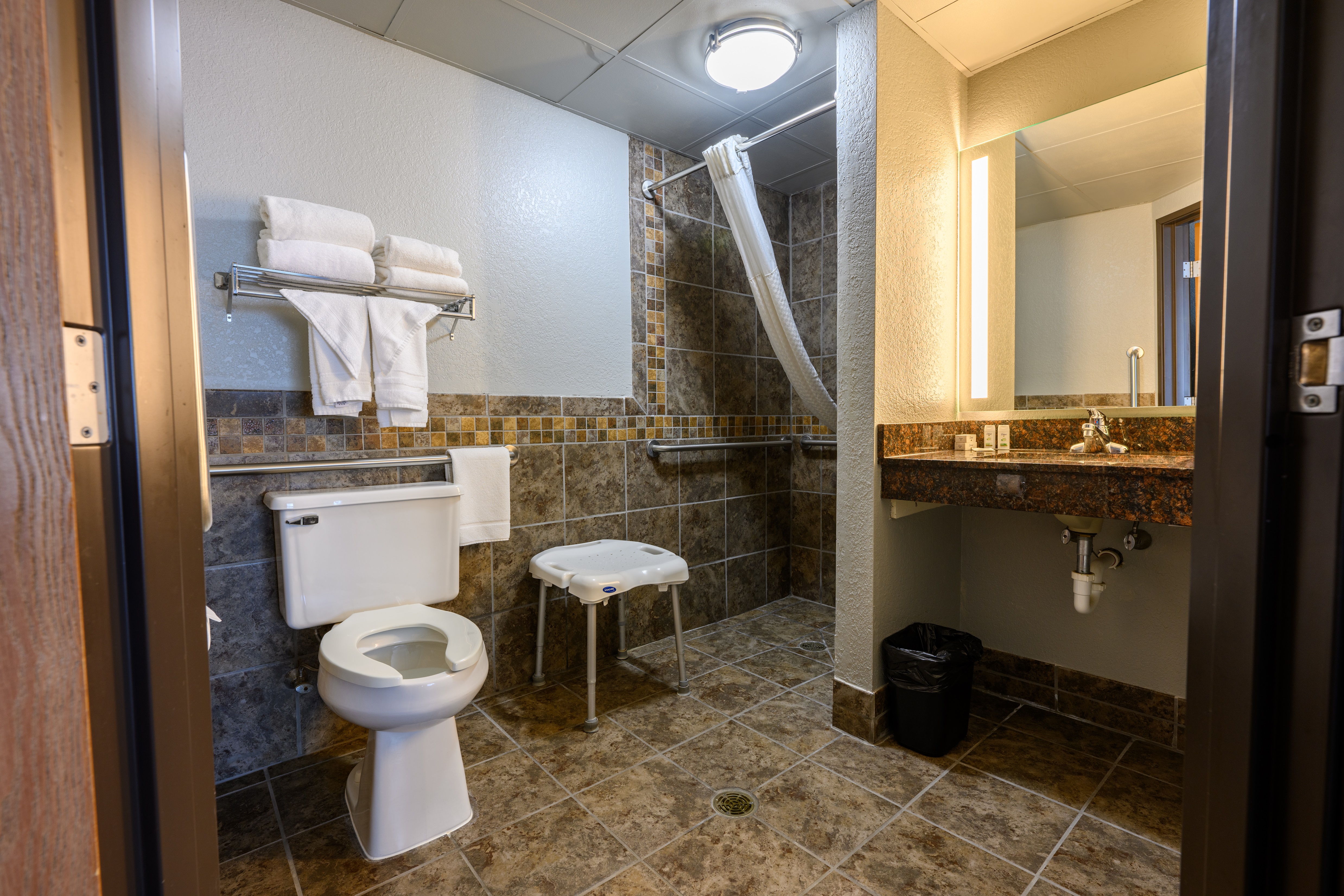 Guest room bath at the AmericInn by Wyndham Monroe in Monroe, Wisconsin
