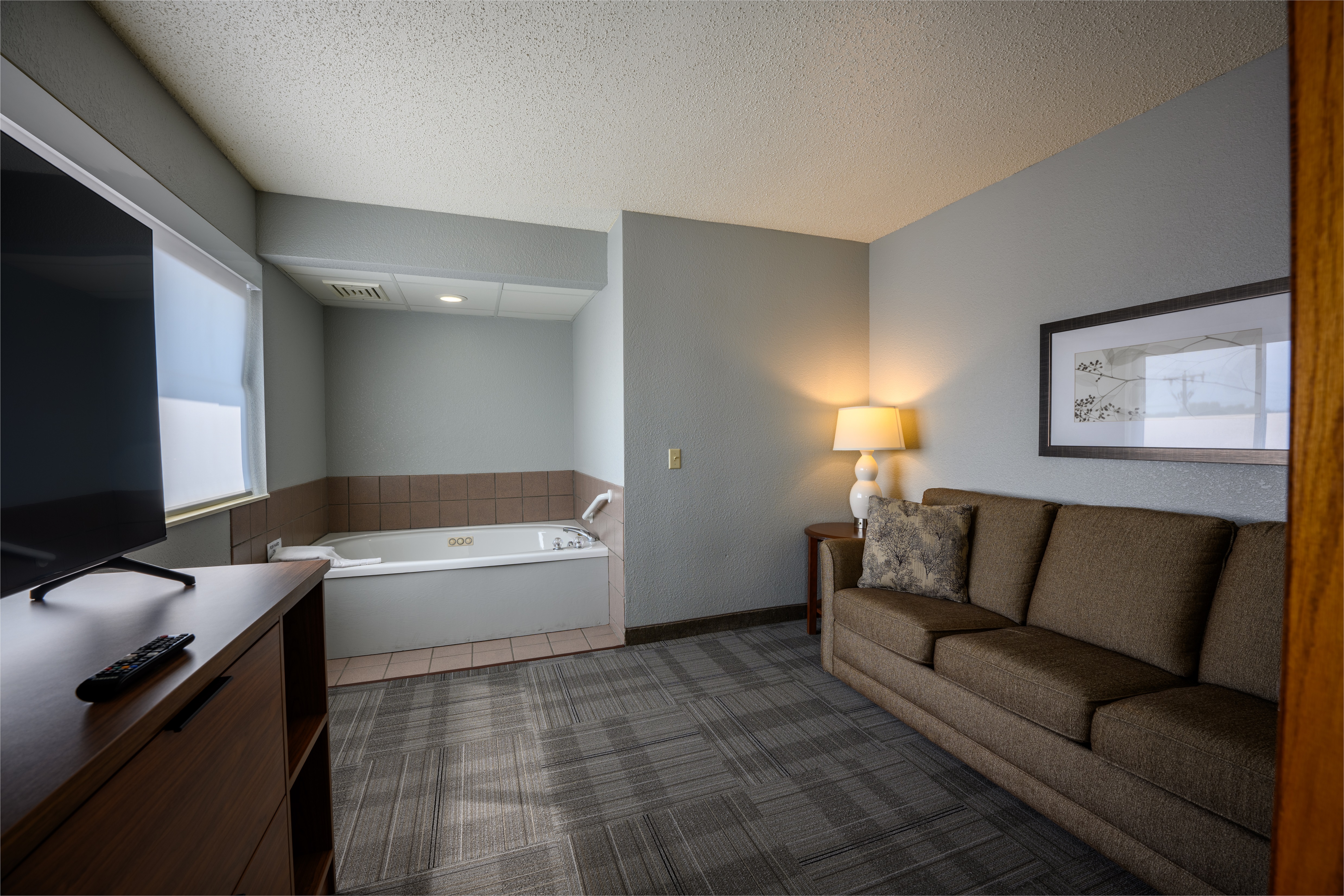 Guest room bath at the AmericInn by Wyndham Monroe in Monroe, Wisconsin