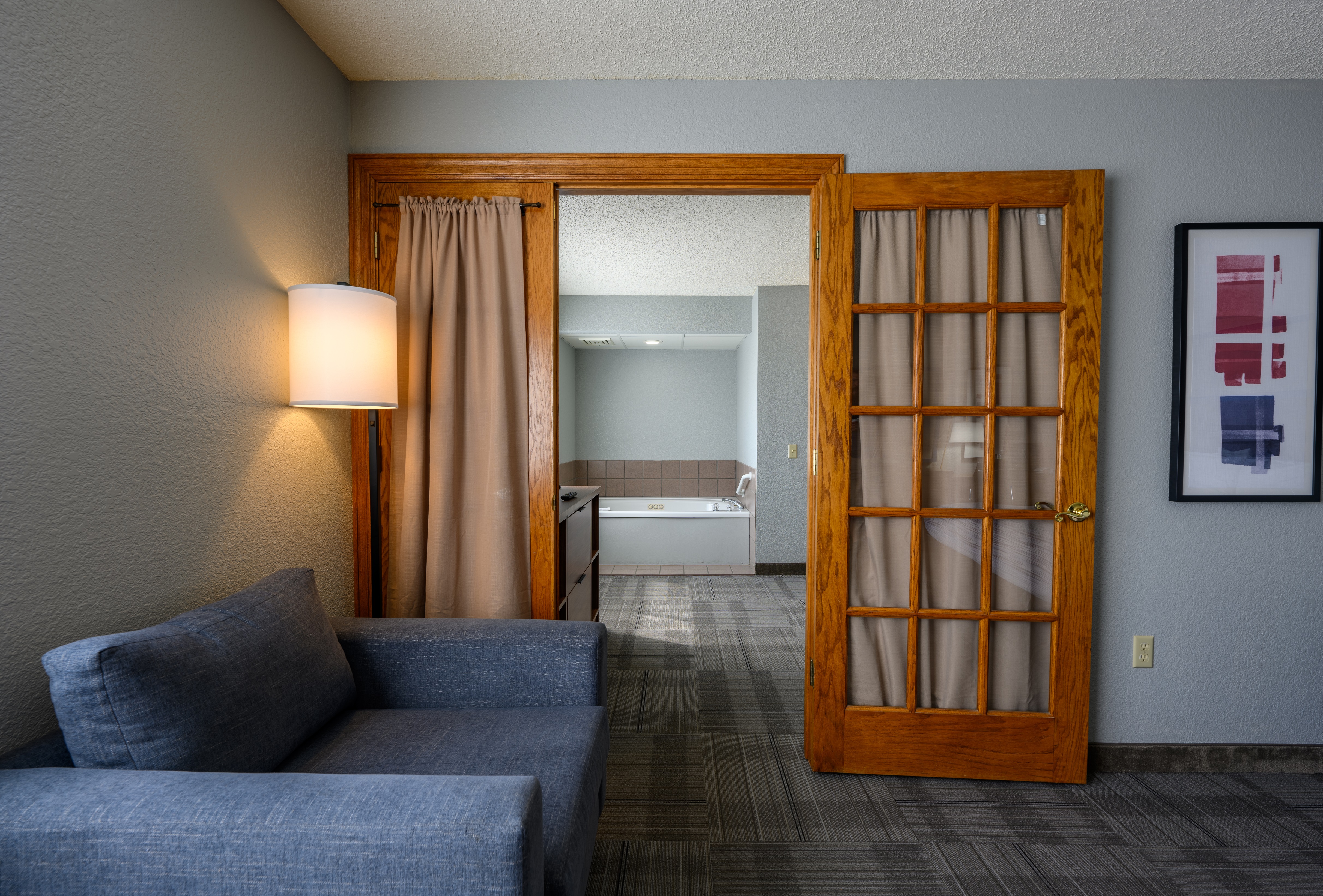 Guest room bath at the AmericInn by Wyndham Monroe in Monroe, Wisconsin