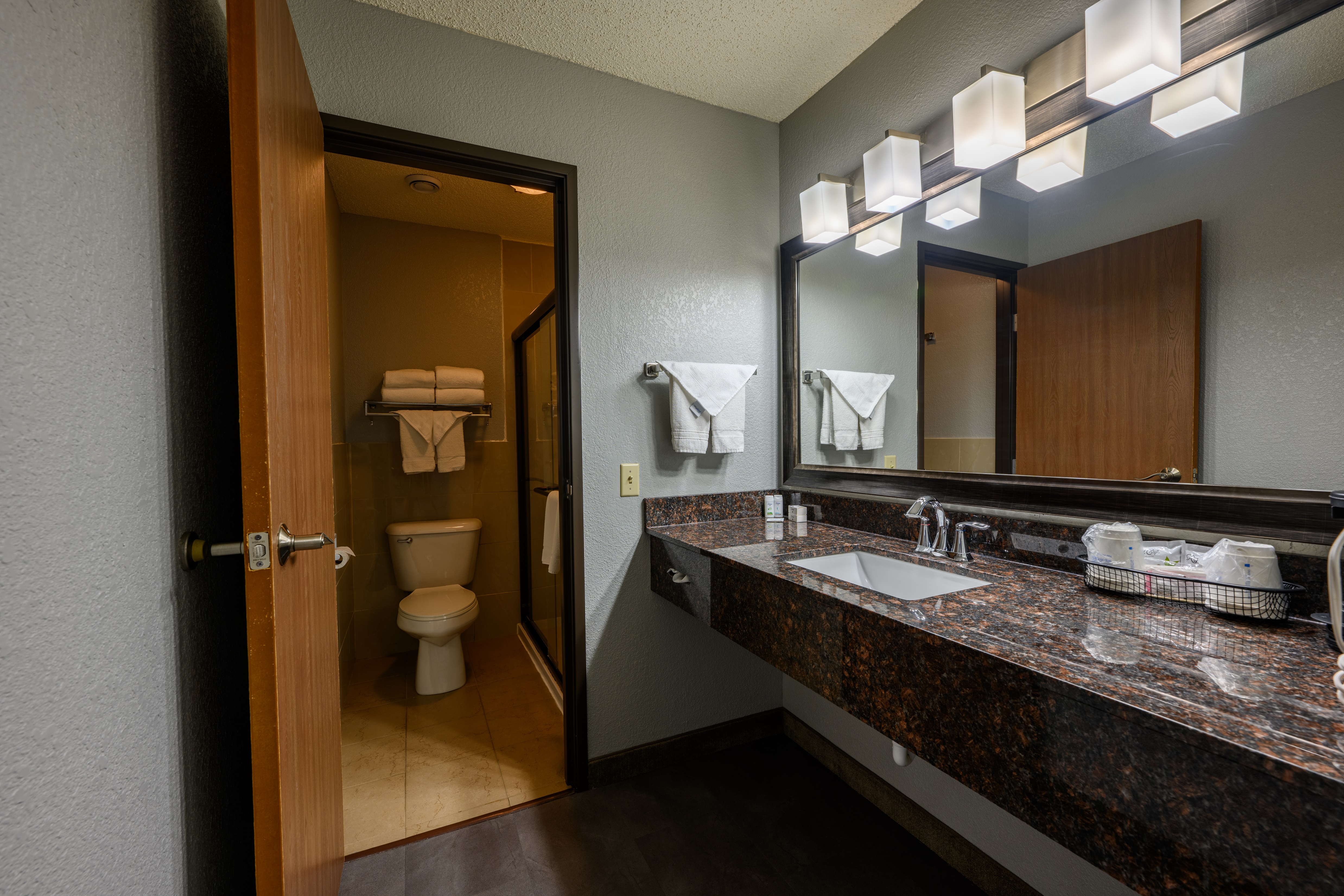 Guest room bath at the AmericInn by Wyndham Monroe in Monroe, Wisconsin