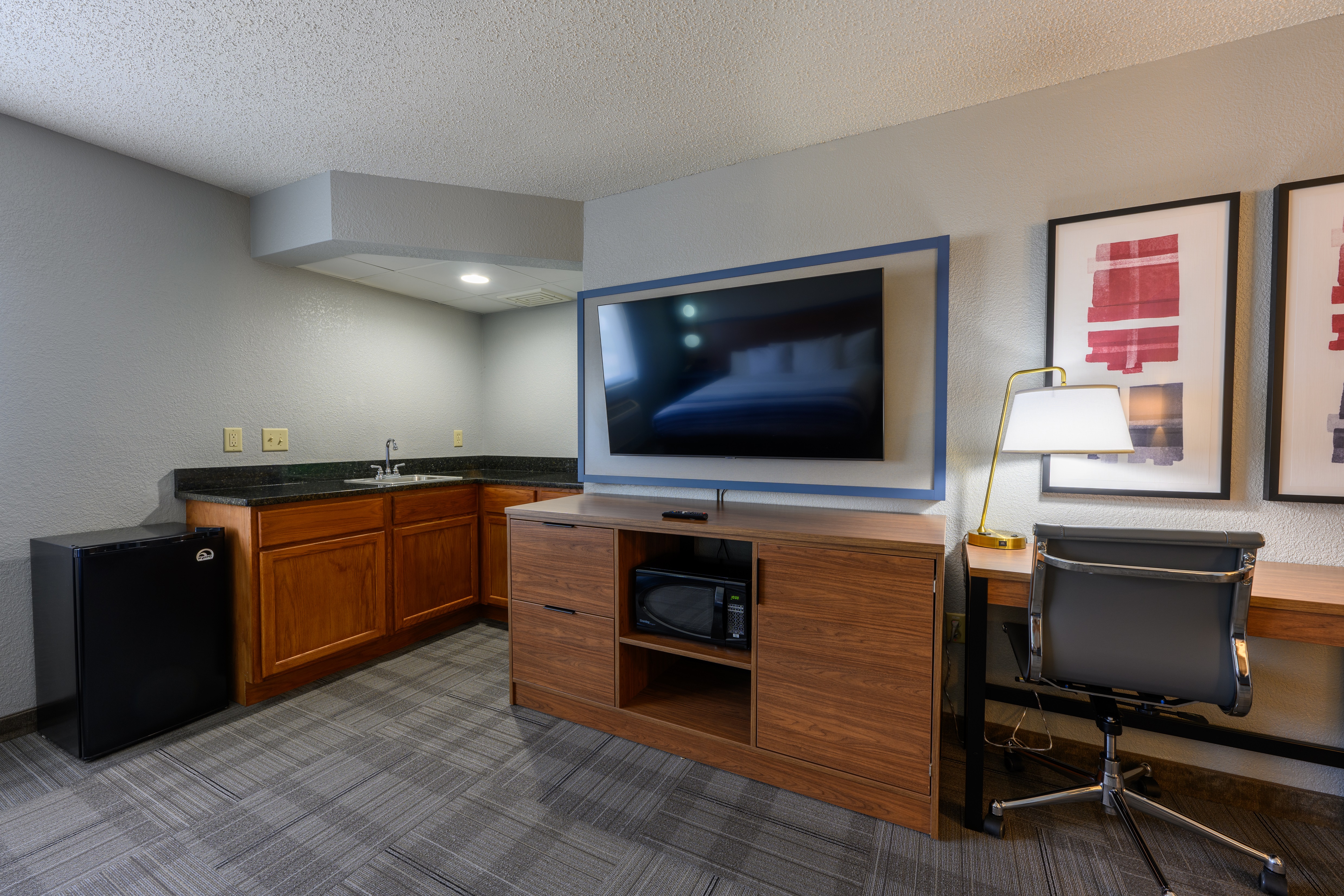 Guest room at the AmericInn by Wyndham Monroe in Monroe, Wisconsin