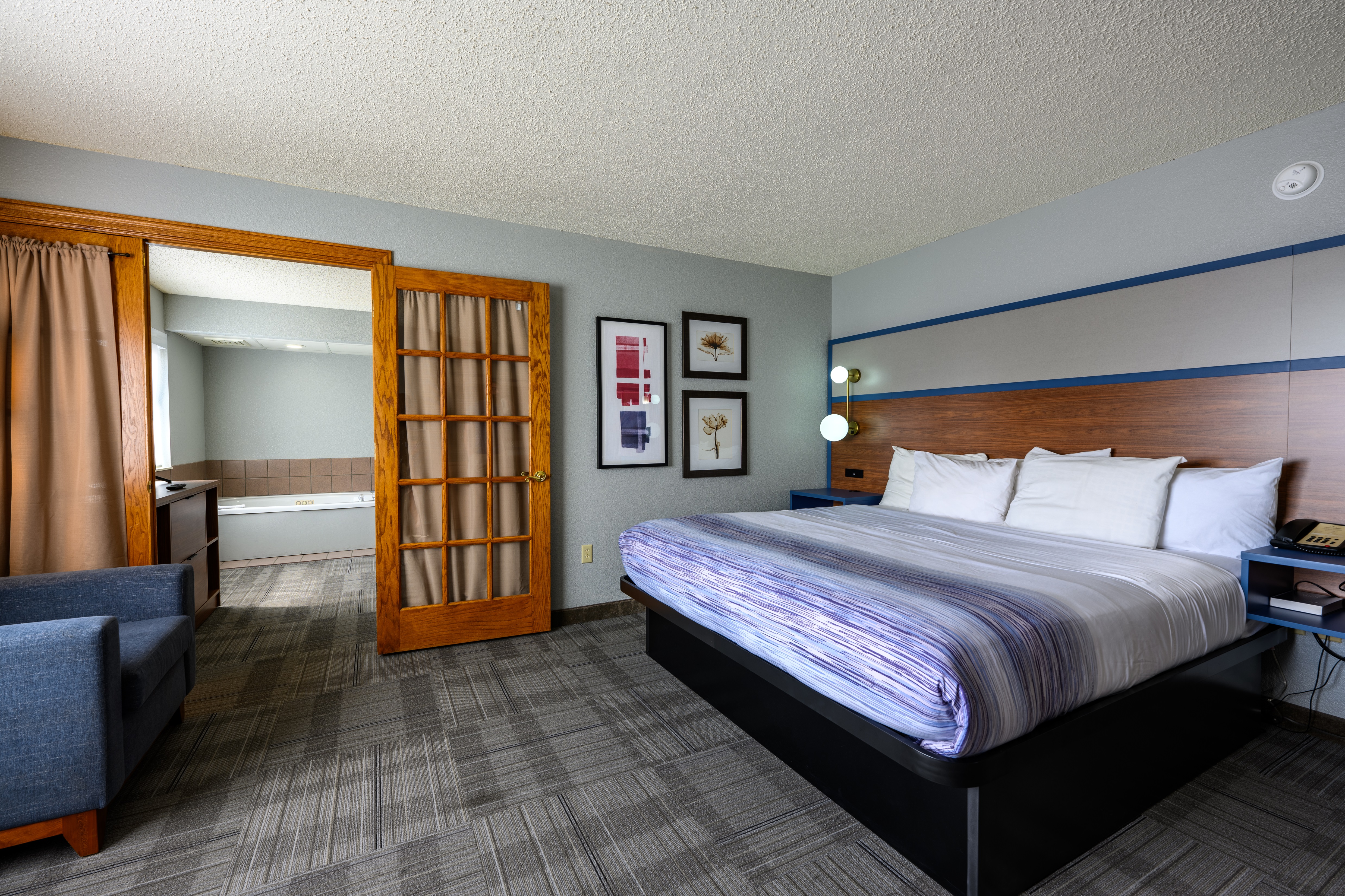 Guest room at the AmericInn by Wyndham Monroe in Monroe, Wisconsin