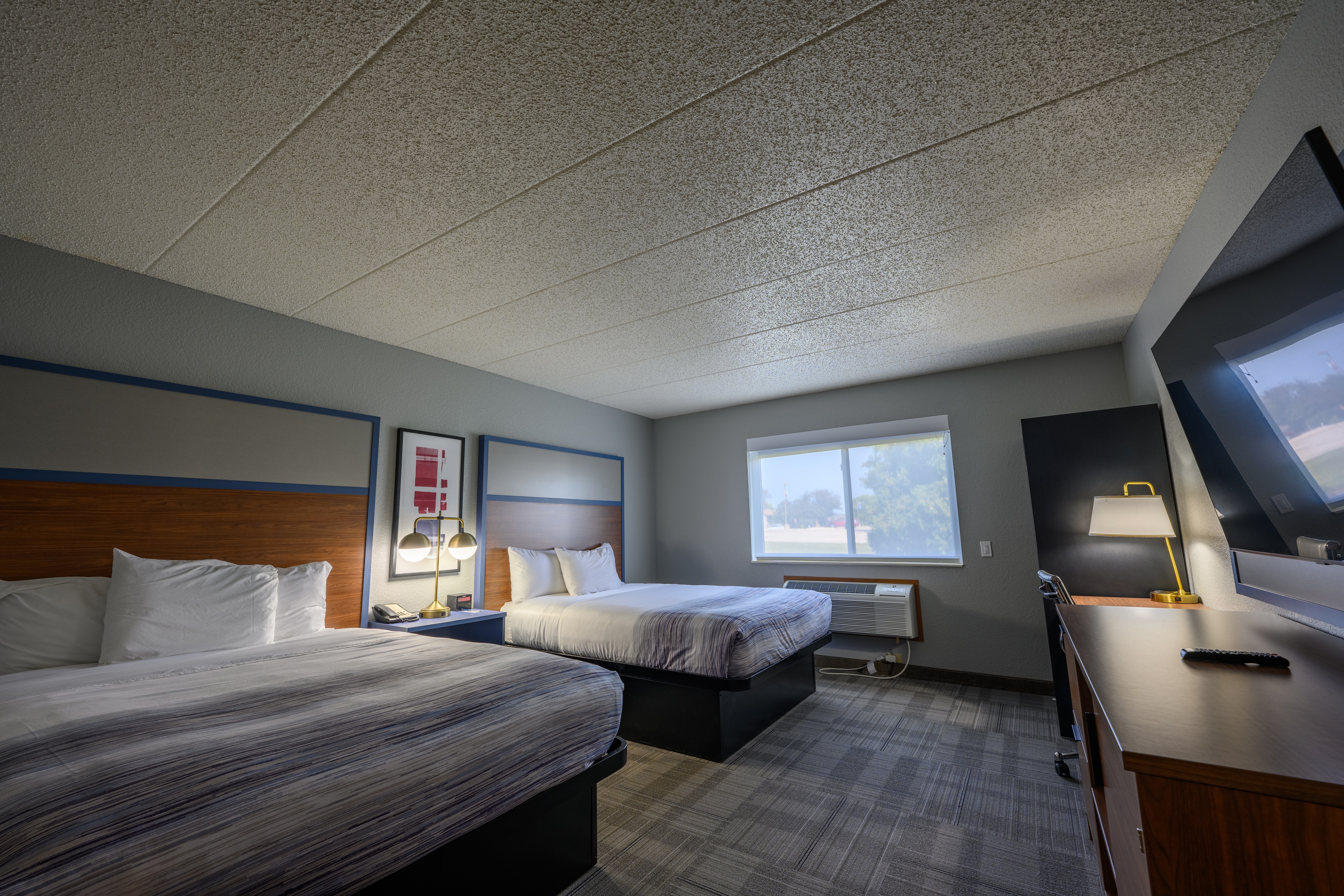 Guest room at the AmericInn by Wyndham Monroe in Monroe, Wisconsin