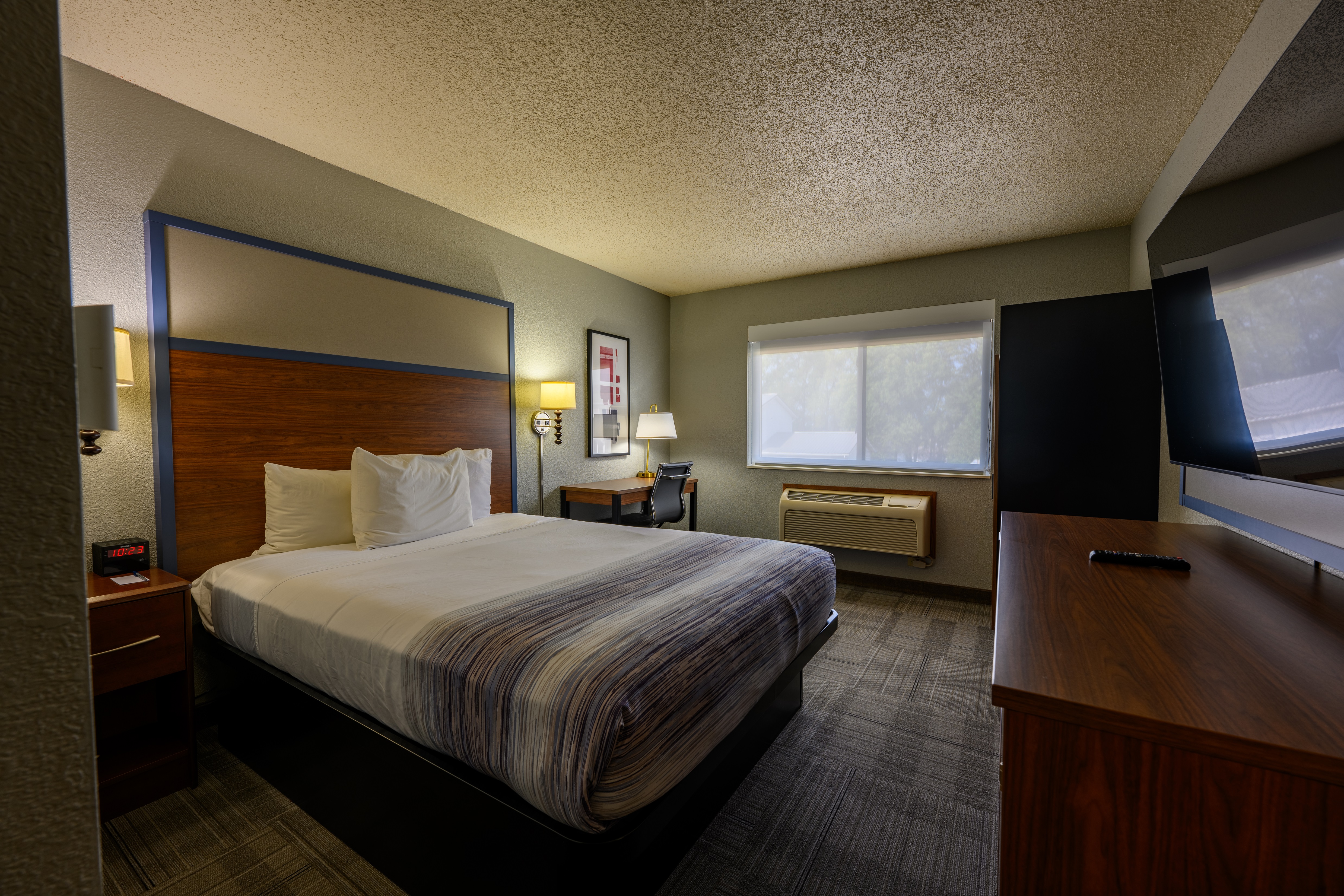 Guest room at the AmericInn by Wyndham Monroe in Monroe, Wisconsin