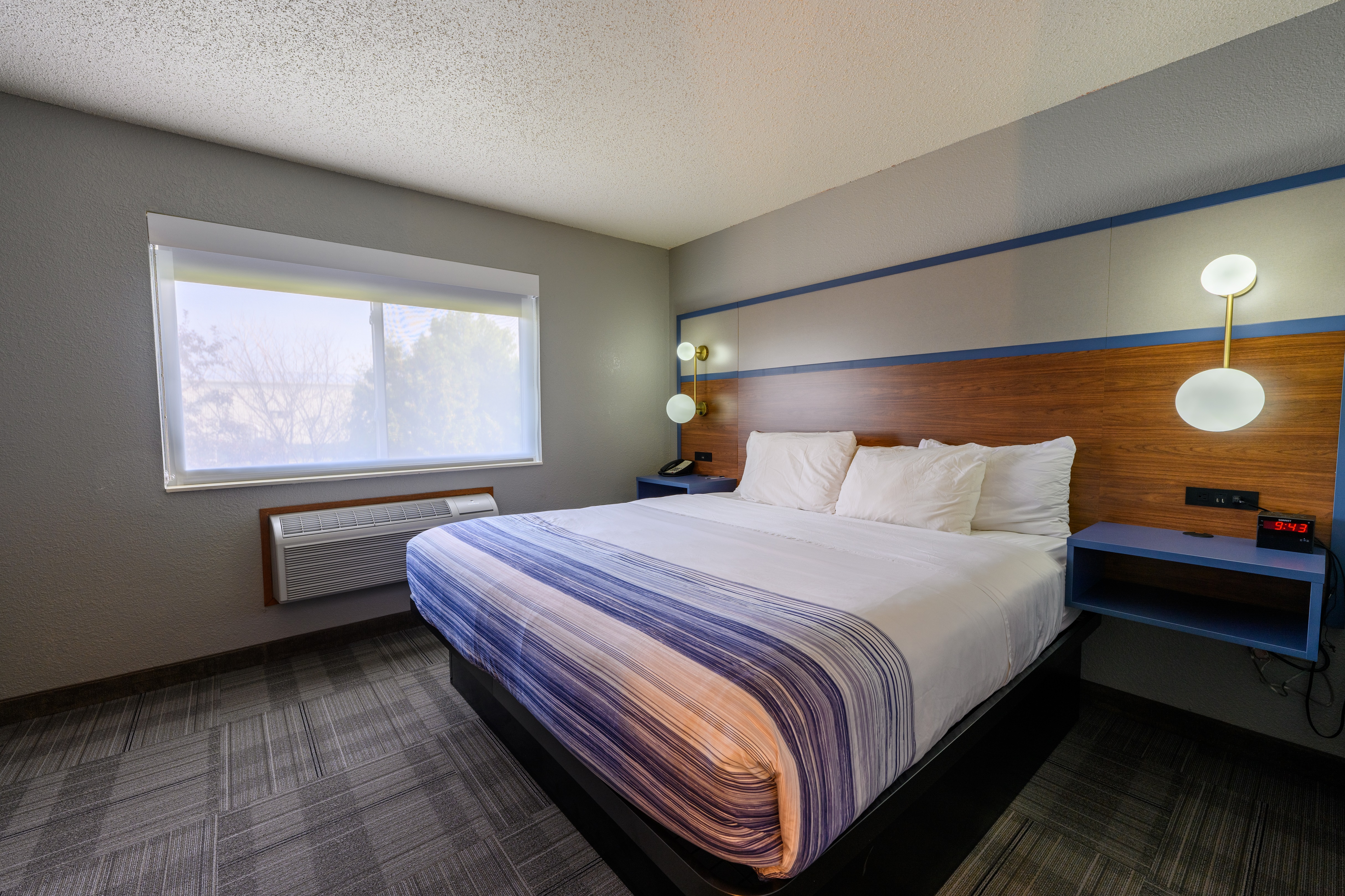 Guest room at the AmericInn by Wyndham Monroe in Monroe, Wisconsin