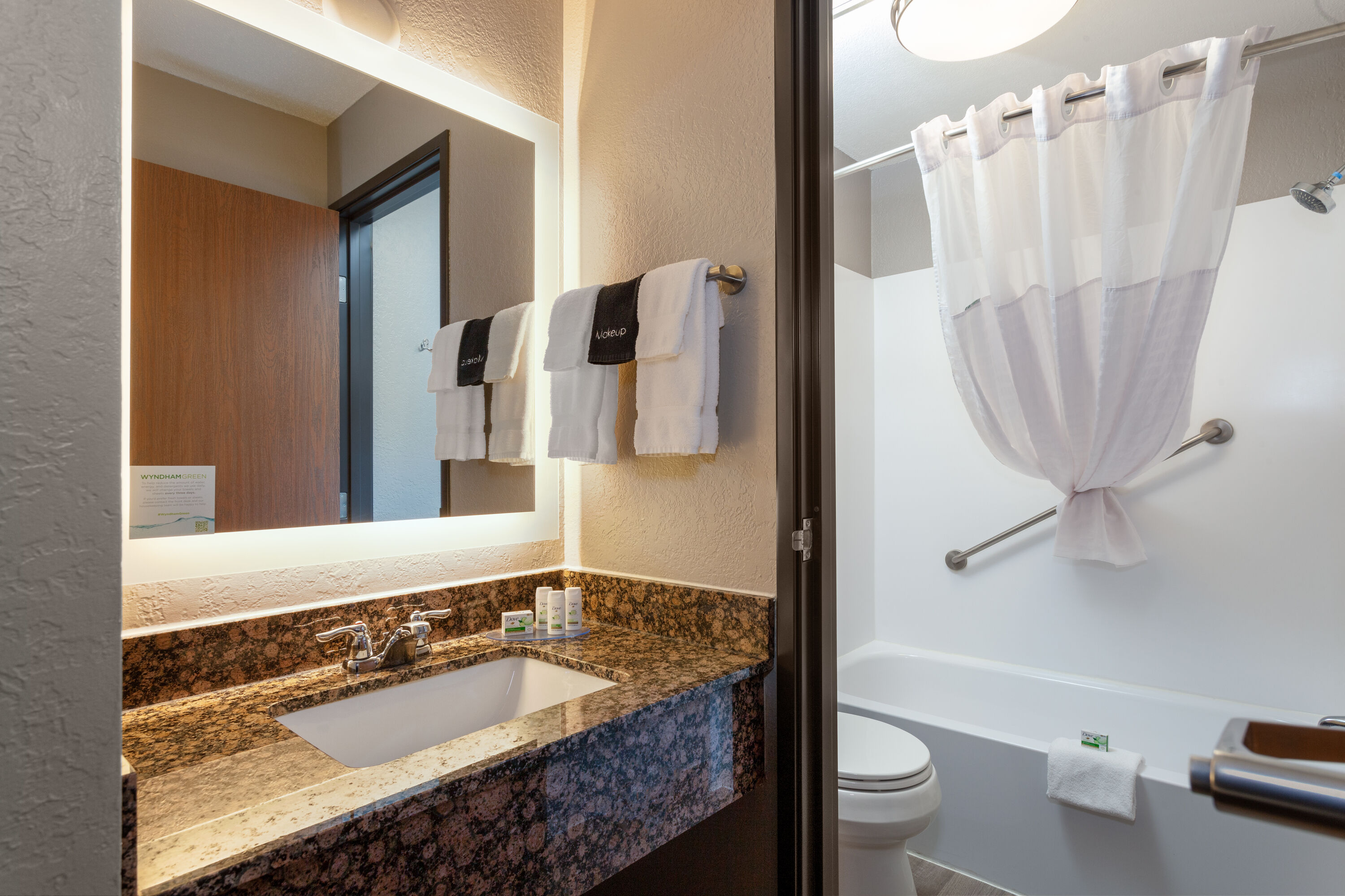 Guest room bath at the AmericInn by Wyndham New Richmond in New Richmond, Wisconsin