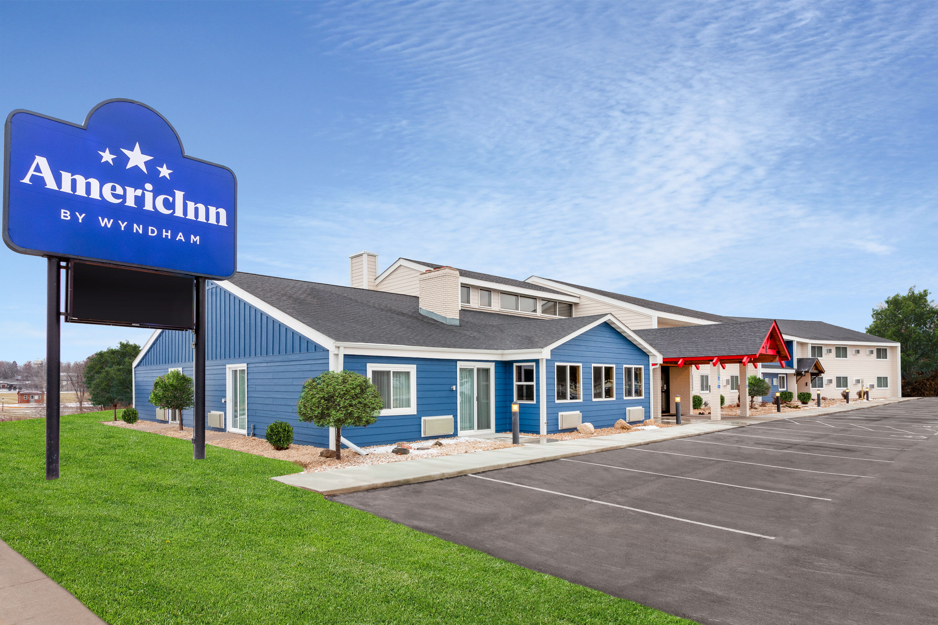 Exterior Day Image of AmericInn by Wyndham New Richmond hotel in New Richmond, Wisconsin