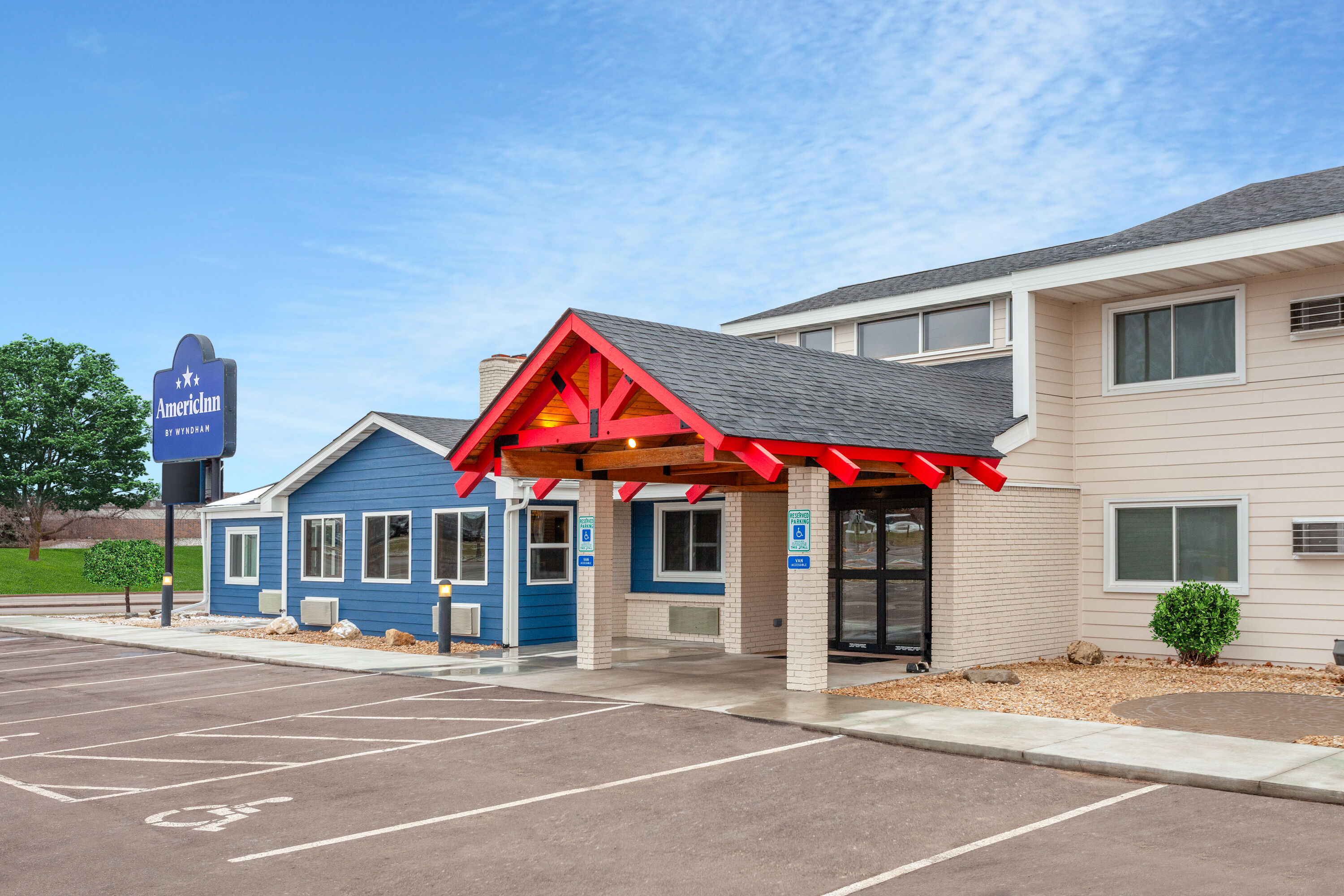 Exterior Day Image of AmericInn by Wyndham New Richmond hotel in New Richmond, Wisconsin