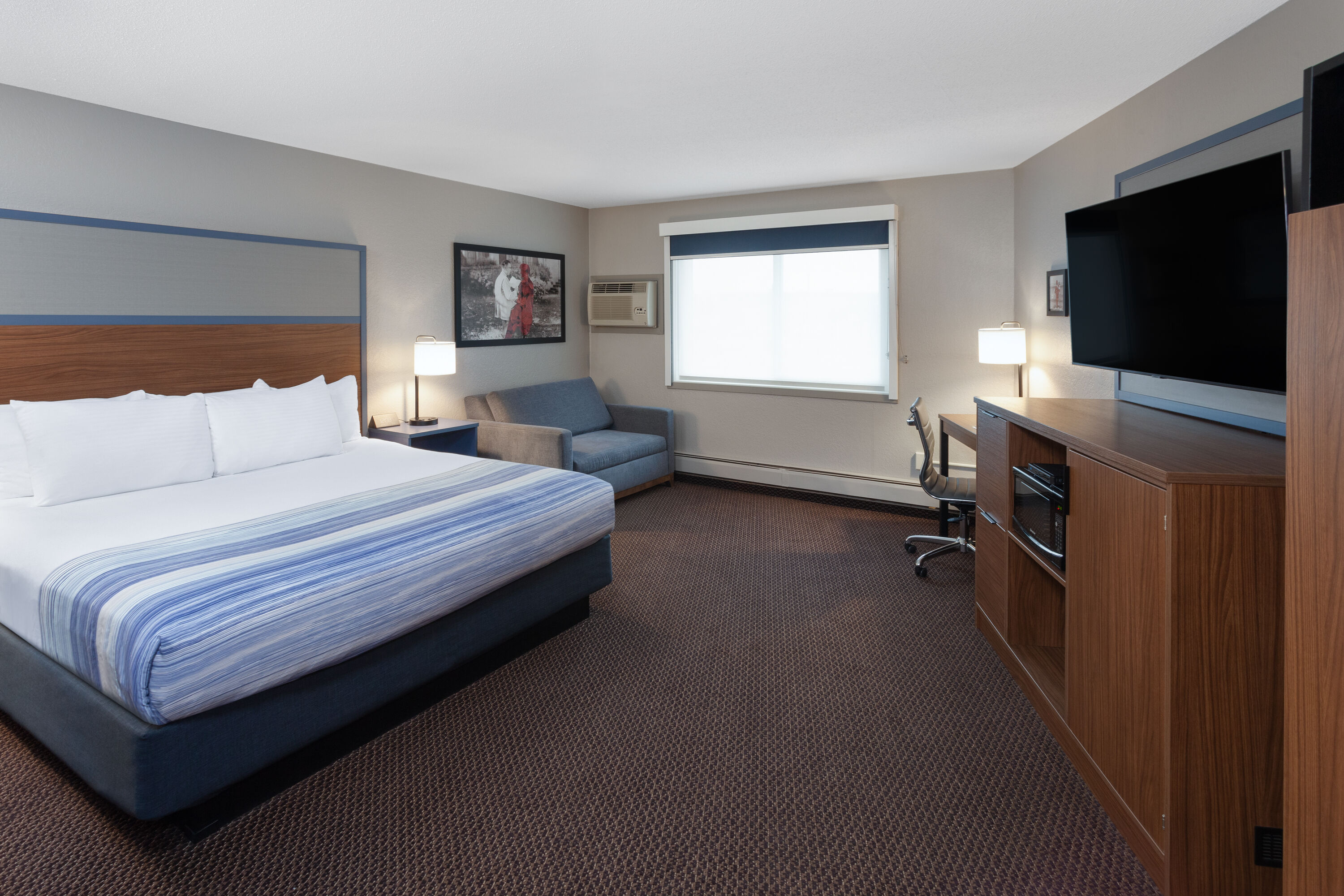 Guest room at the AmericInn by Wyndham New Richmond in New Richmond, Wisconsin
