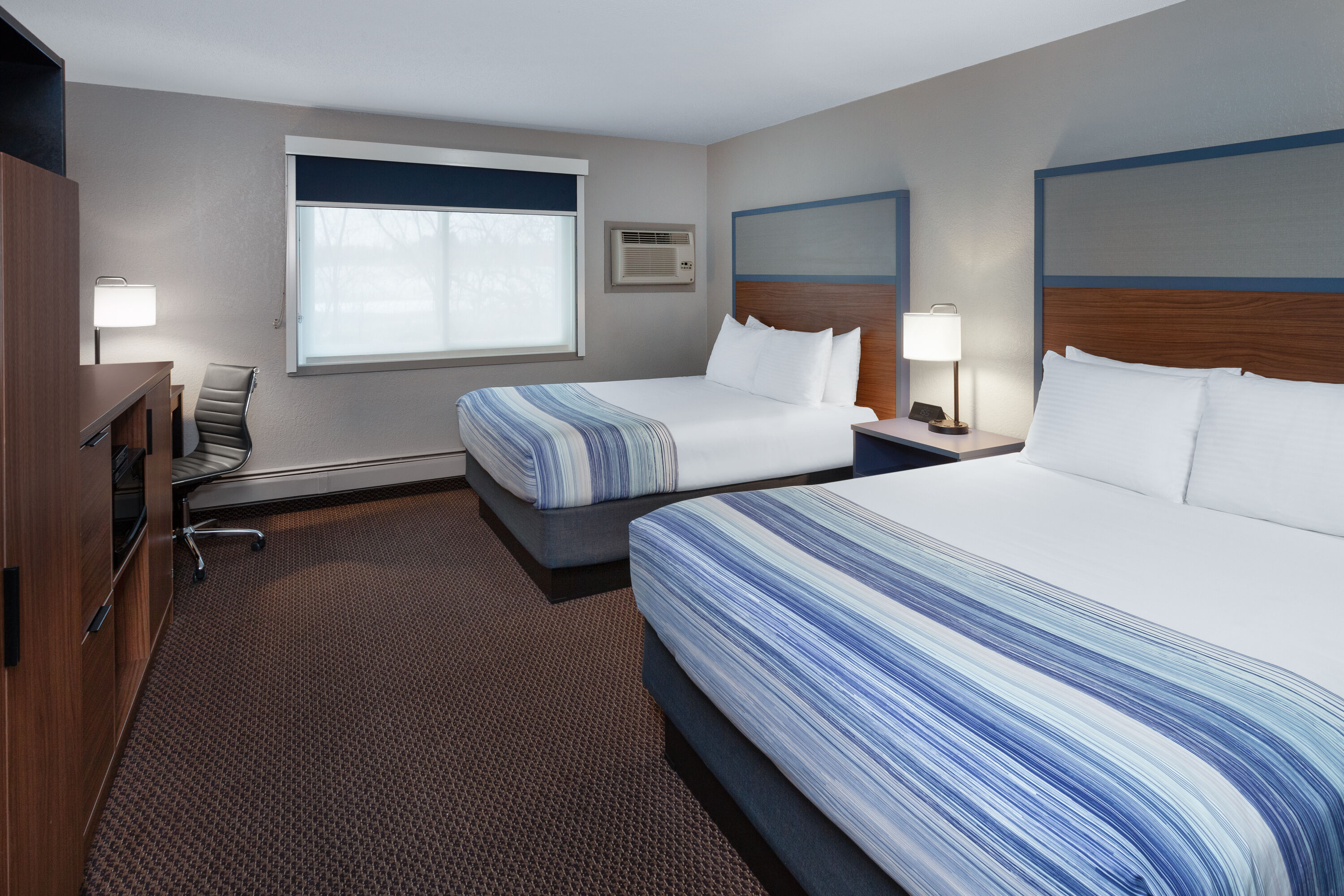 Double bed guest room at the AmericInn by Wyndham New Richmond in New Richmond, Wisconsin