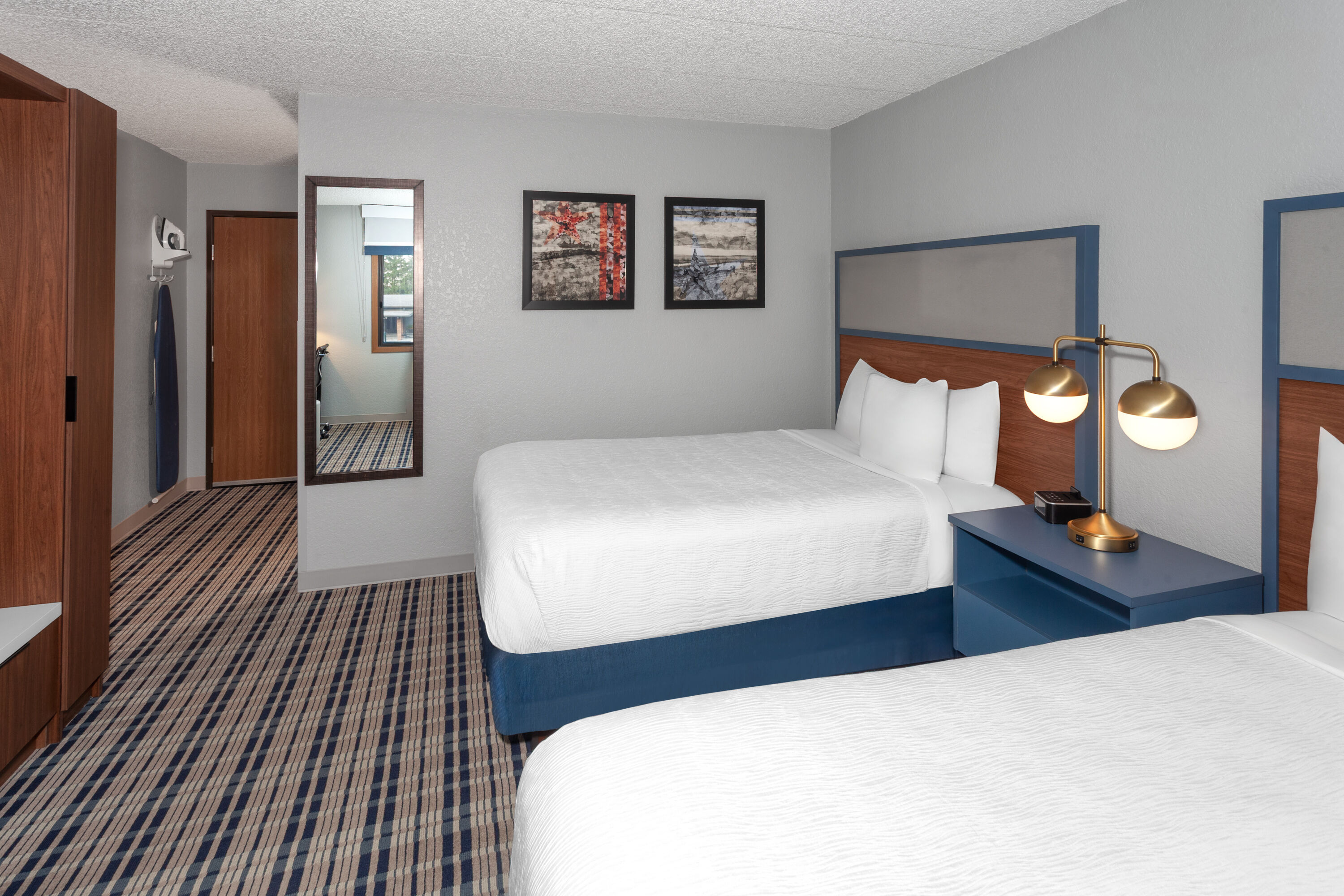 Guest room at the AmericInn by Wyndham Plymouth in Plymouth, Wisconsin