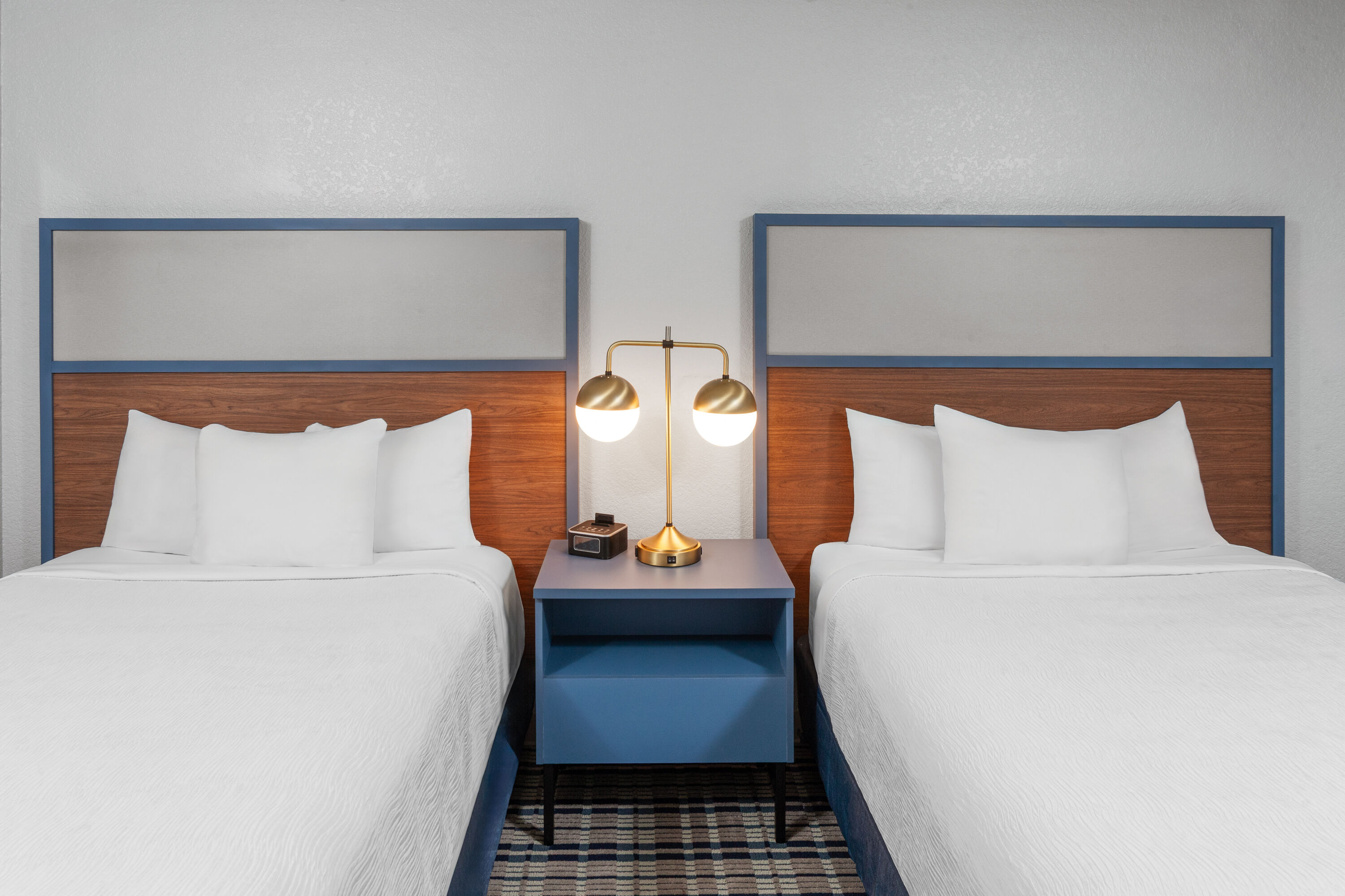 Guest room at the AmericInn by Wyndham Plymouth in Plymouth, Wisconsin